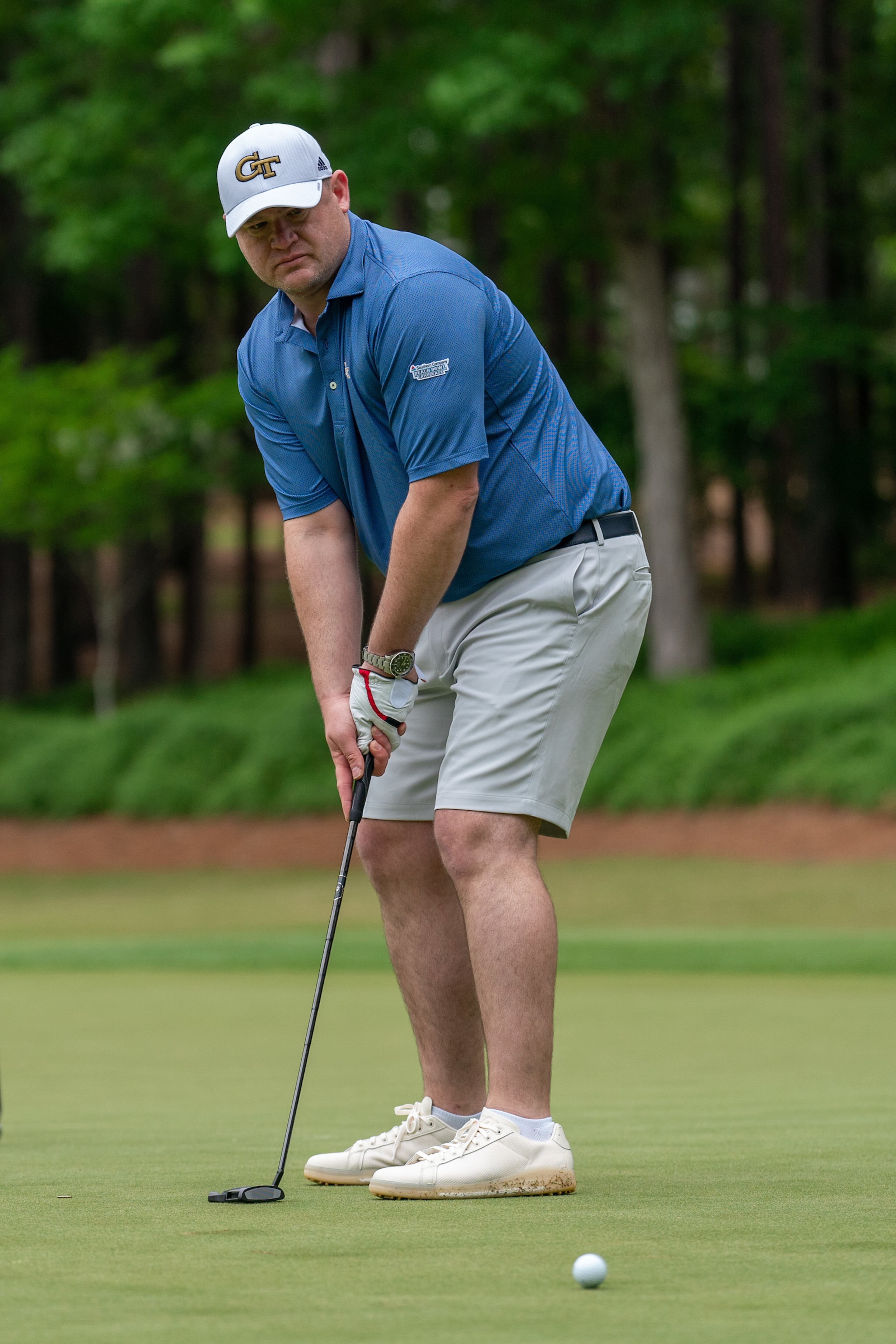 Georgia Tech coach Brent Key attempts a putt. Photos by Paul Abell