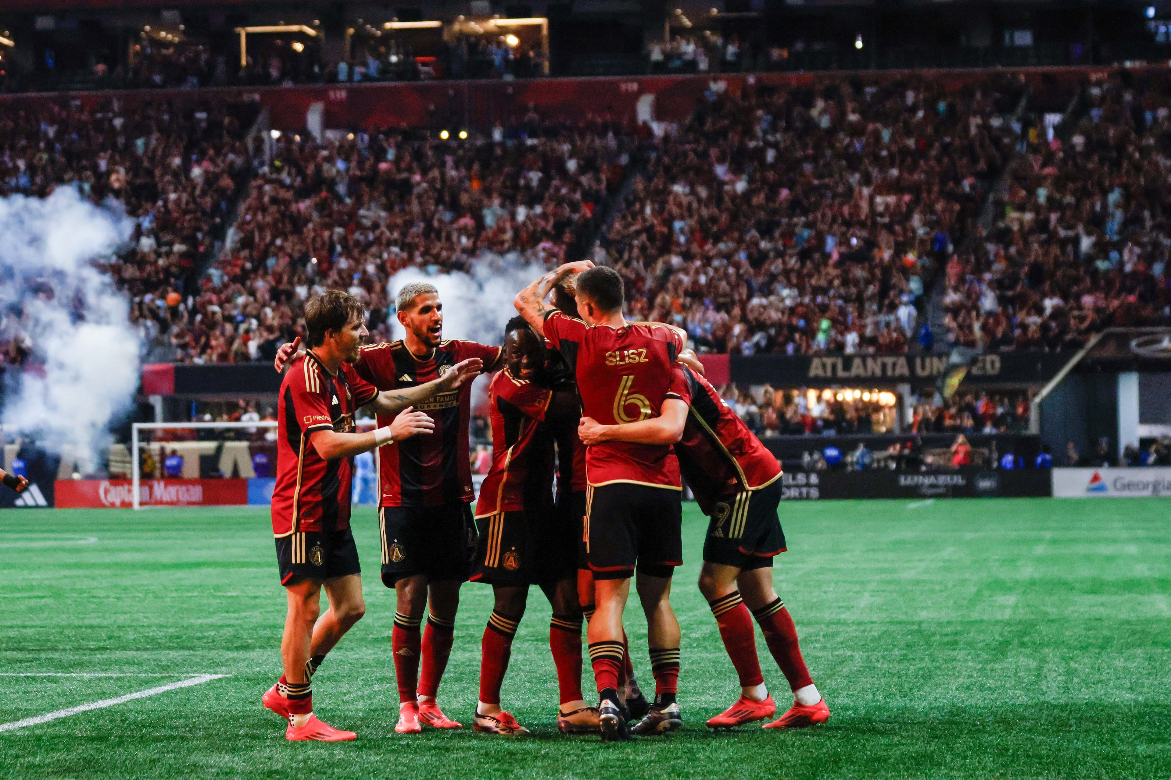 Atlanta United players celebrate with forward Xande Silva (16).
(Miguel Martinez/ AJC)