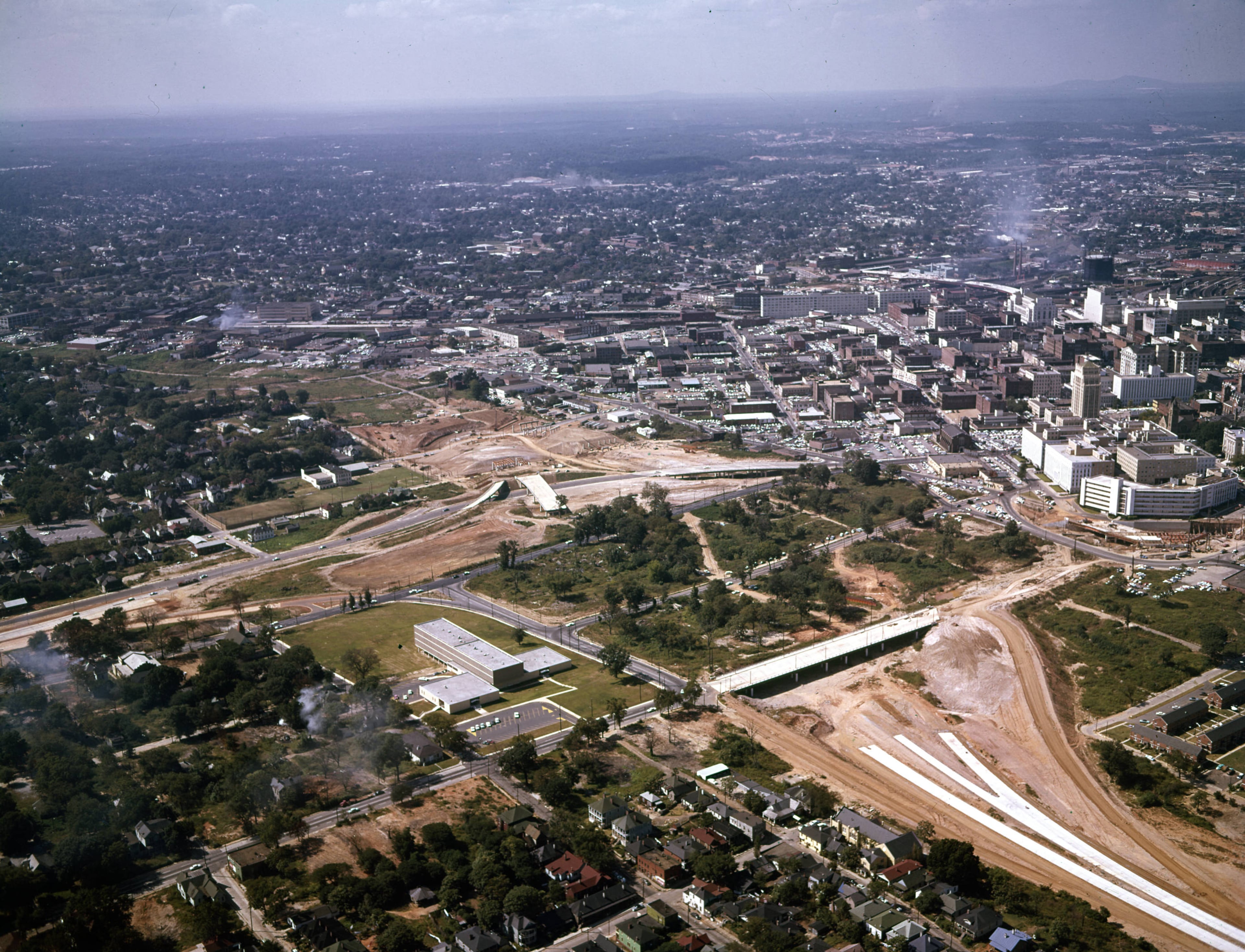 Aerial view over the construction of the Downtown Connector near the Georgia State Capitol building, looking southwest, Atlanta, Georgia, September 27, 1961. Photo: floyd Jillson/AJC