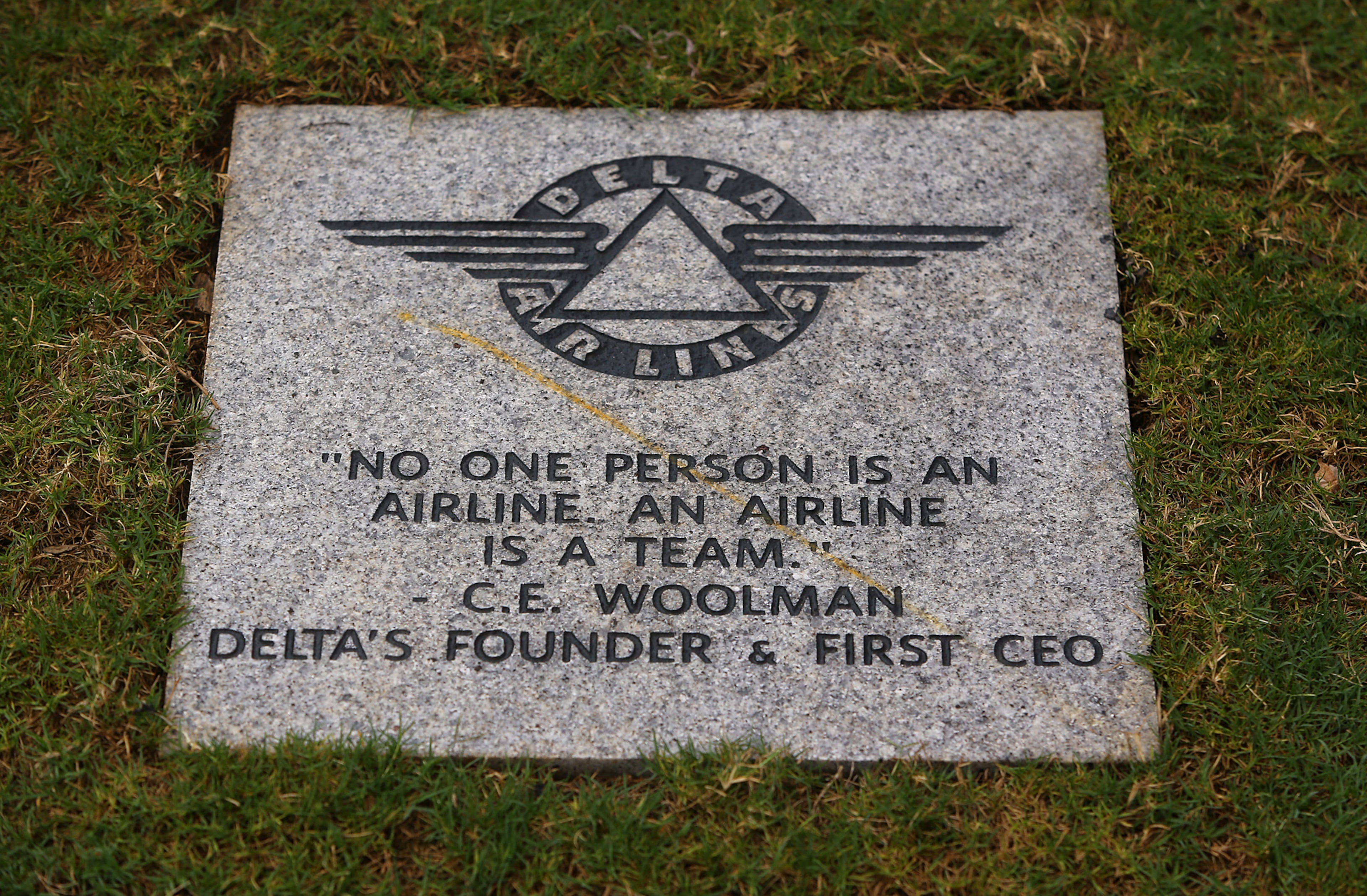 061214 ATLANTA: A quote from Delta's founder and first CEO C. E. Woolman " No one person is an airline. An airline is a team." Seen in granite outside the Delta Flight Museum on Thursday, June 12, 2014, in Atlanta. CURTIS COMPTON / CCOMPTON@AJC.COM