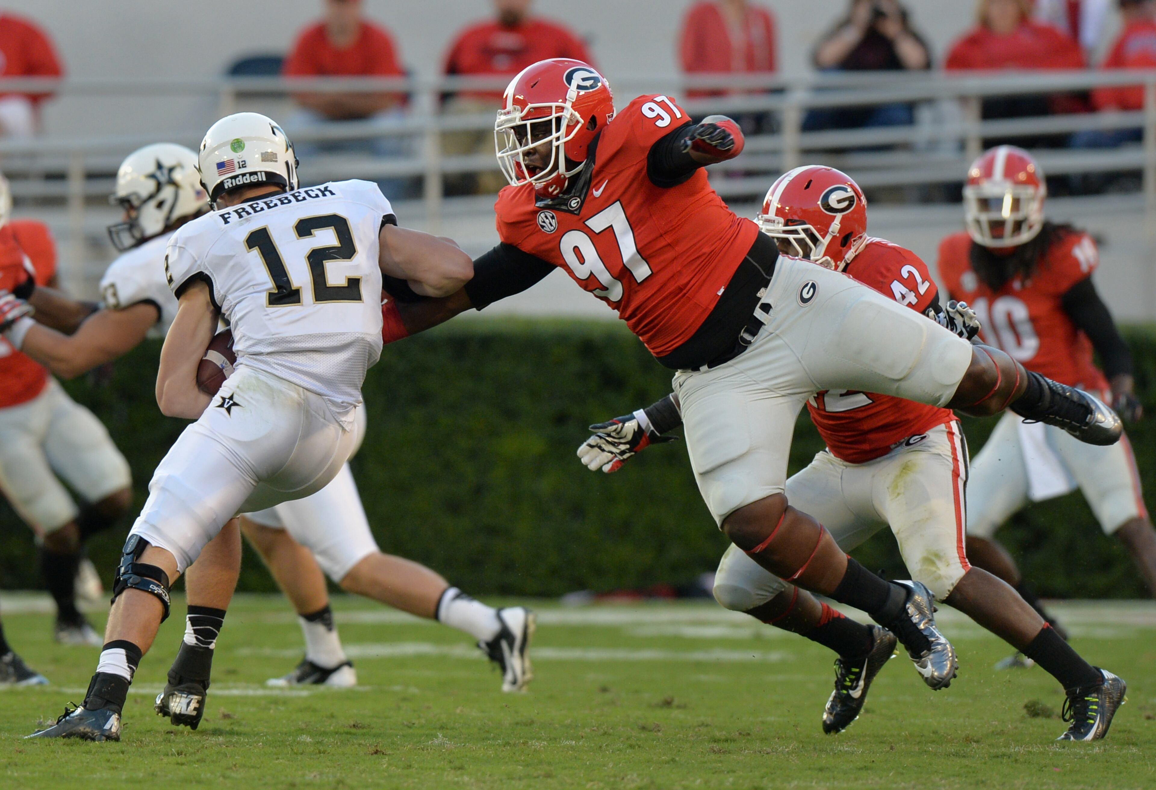 Defensive lineman John Atkins: The 299-pound Atkins leaps for Vanderbilt quarterback Wade Freebeck on Oct. 4, 2014. BRANT SANDERLIN / BSANDERLIN@AJC.COM