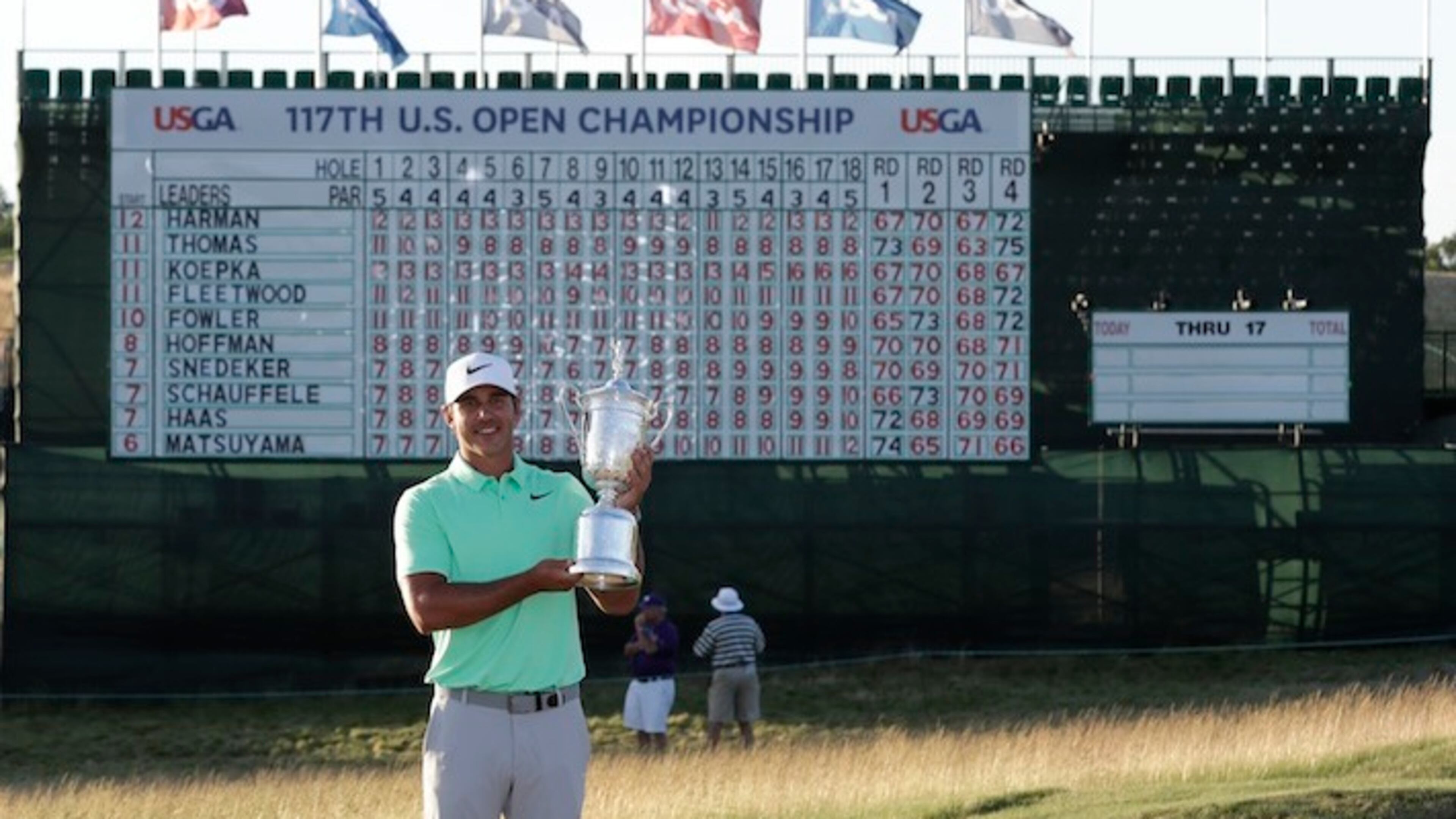Brooks Koepka poses with the winning trophy after the U.S. Open golf tournament Sunday, June 18, 2017, at Erin Hills in Erin, Wis. (AP Photo/David J. Phillip)