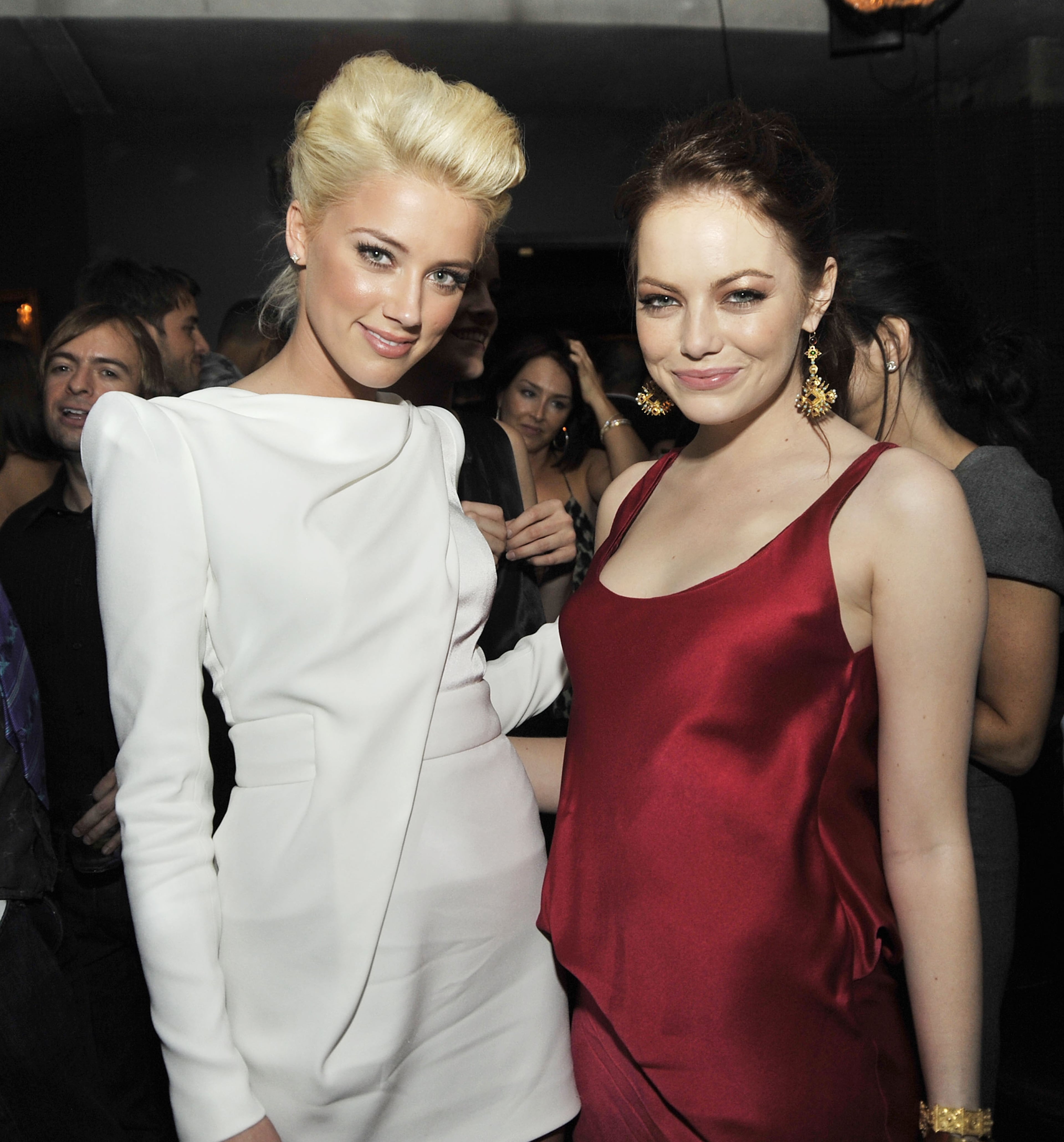 Actors Amber Heard (L) and Emma Stone pose at the after party for the premiere of Sony Pictures' "Zombieland" at h.wood on September 23, 2009 in Los Angeles, California. (Photo by Kevin Winter/Getty Images)