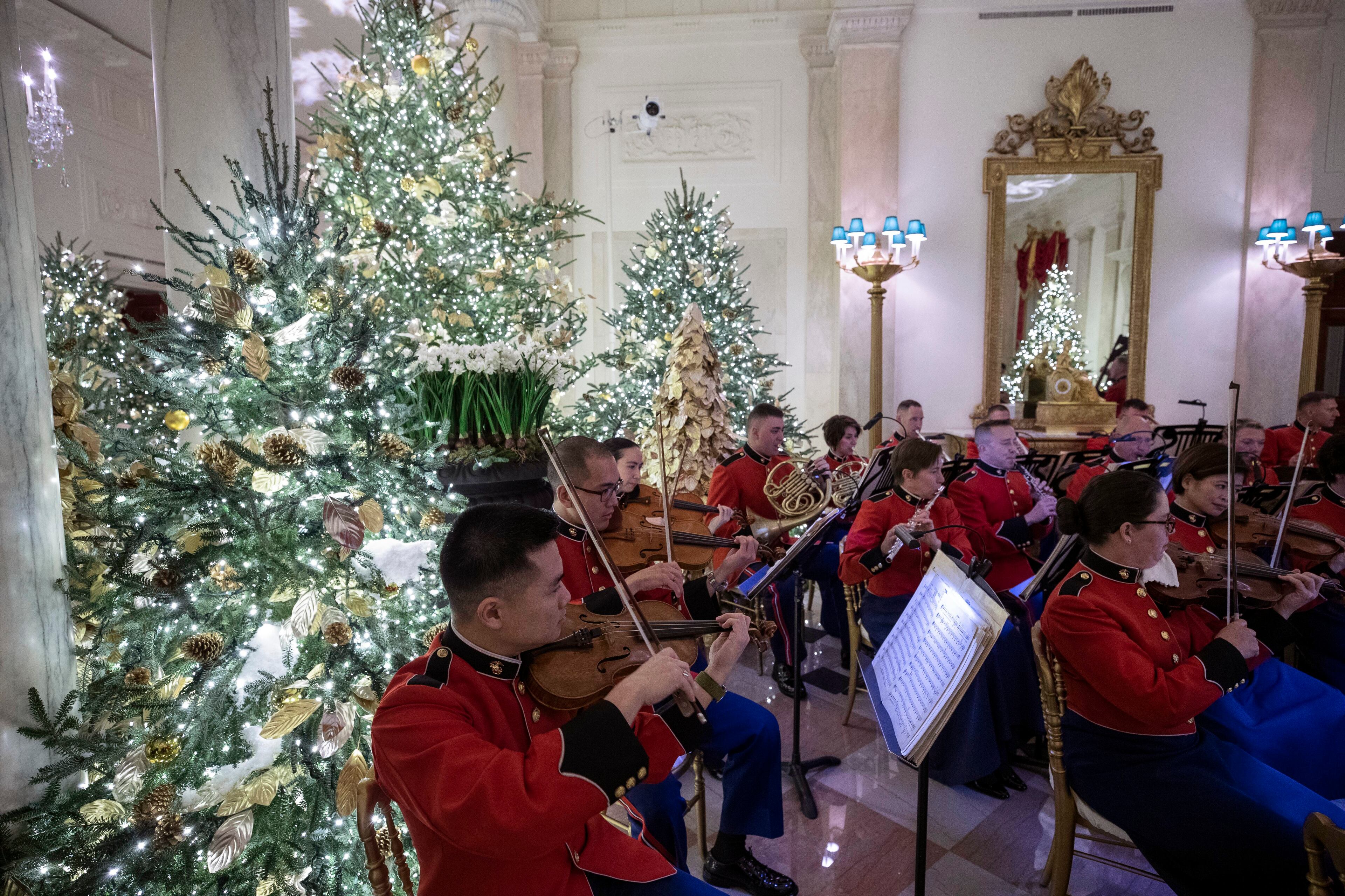 The "President's Own," Marine Corps Band plays in the Grand Foyer during the 2019 Christmas preview at the White House, Monday, Dec. 2, 2019, in Washington. (AP Photo/Alex Brandon)