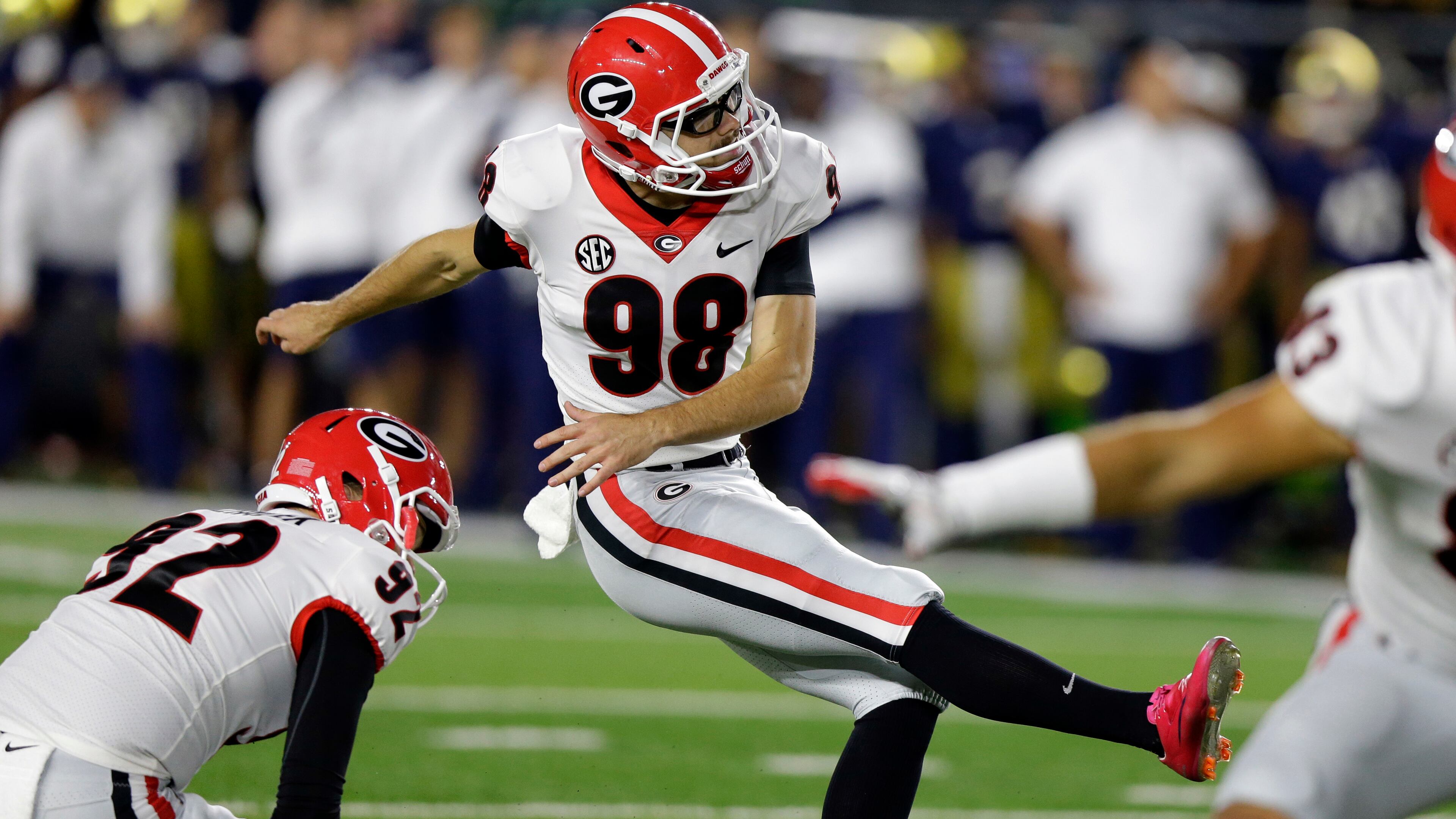 Georgia's Rodrigo Blankenship (98) kicks a field goal from the hold of Cameron Nizialek to give the Bulldogs the lead against Notre Dame Saturday, Sept. 9, 2017, in South Bend, Ind. Georgia won 20-19. (AP Photo/Michael Conroy)