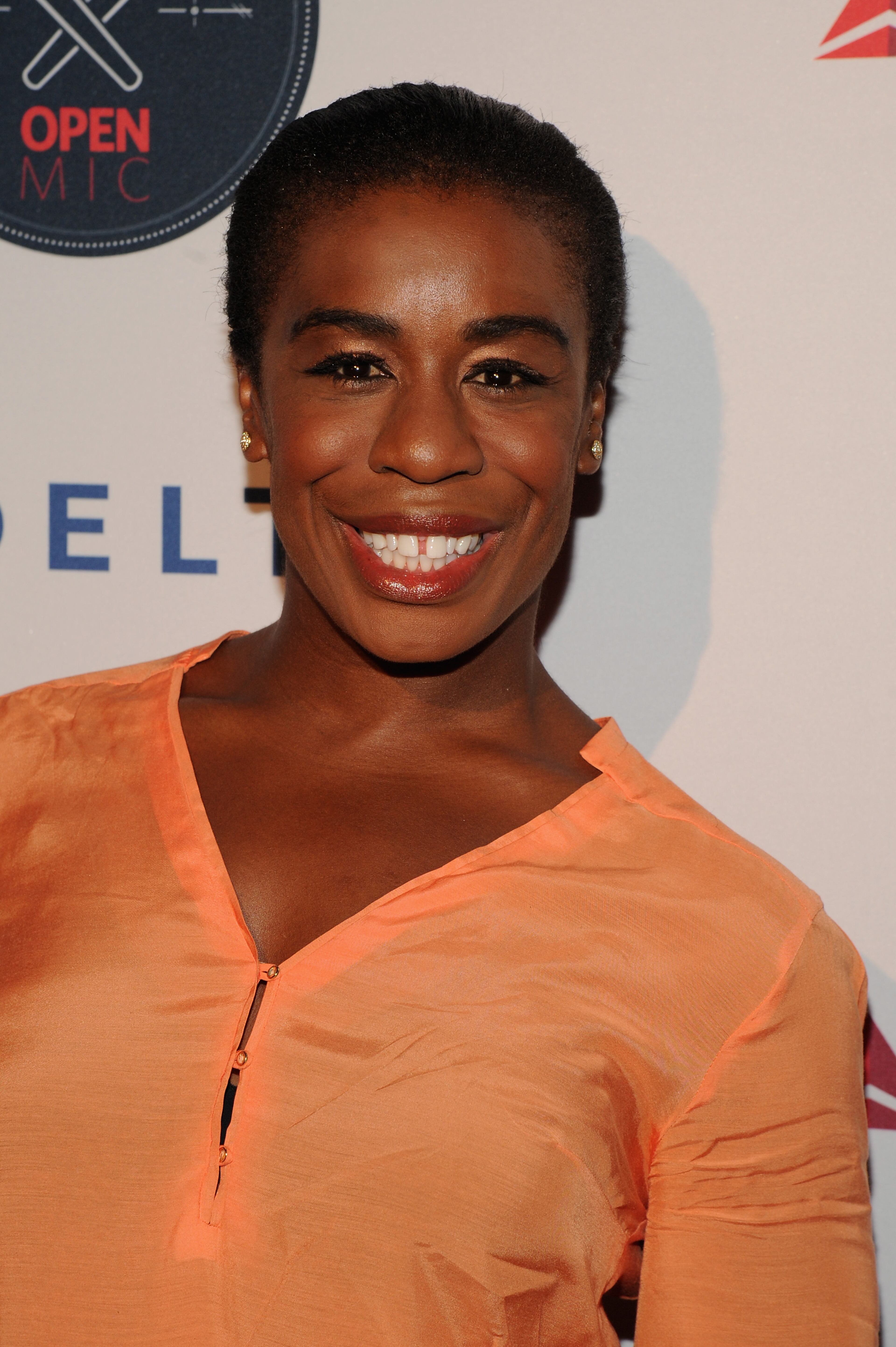 NEW YORK, NY - AUGUST 20: Uzo Aduba attends the Delta OPEN Mic, a private karaoke event in celebration of her upcoming defending tennis championship and magazine cover profile with celebrity guests and friends at Arena, on August 20, 2014 in New York City. (Photo by Bryan Bedder/Getty Images for Delta)