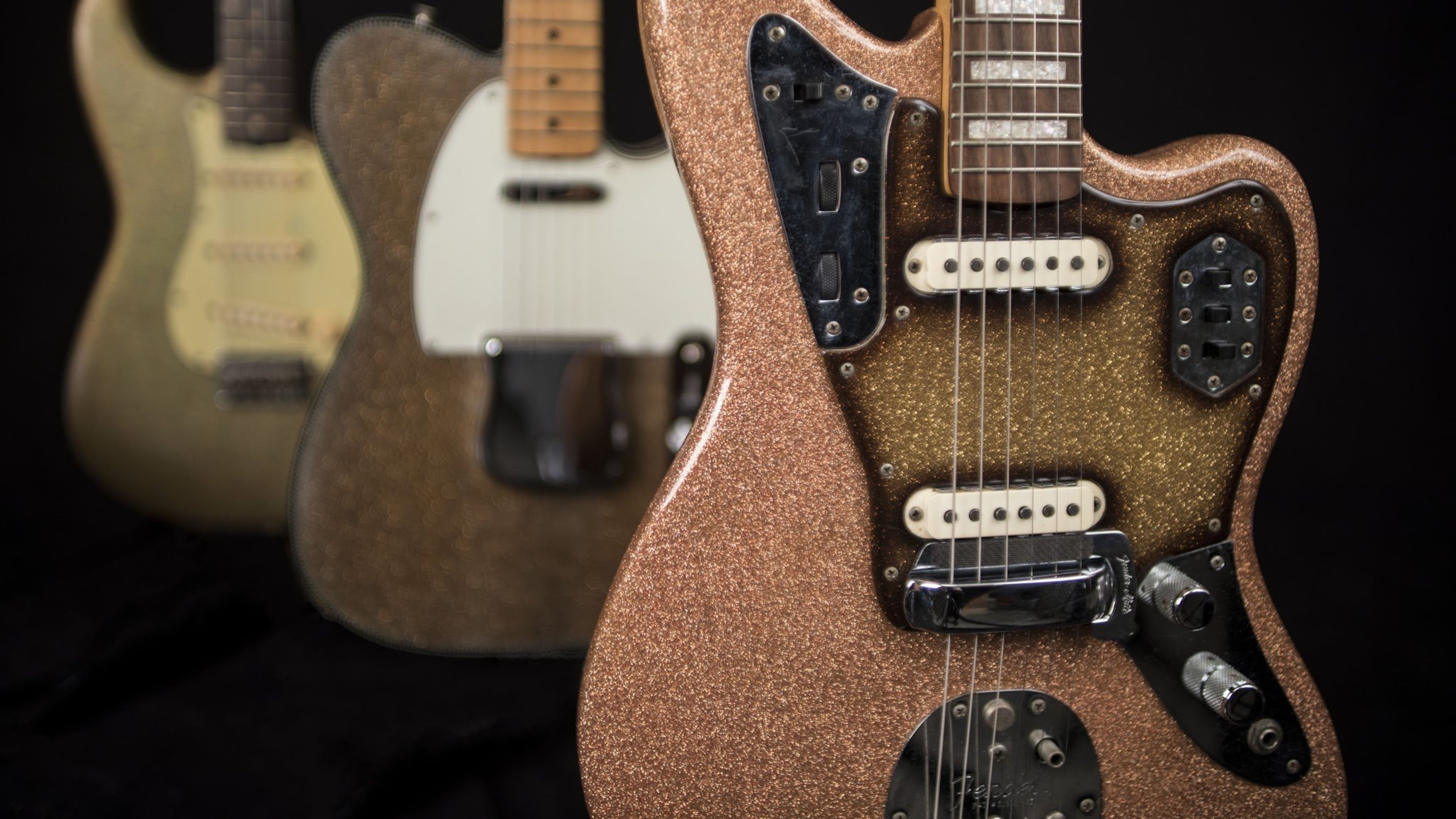 Among the collection at Songbirds Guitar Museum in Chattanooga, Tenn., is, (left to right) a 1963 Fender Stratocaster in Champagne Sparkle, a 1964 Fender Telecaster in Gold Sparkle and a 1966 Fender Jaguar in Pink Champagne Sparkle. CONTRIBUTED BY SONGBIRDS GUITAR MUSEUM