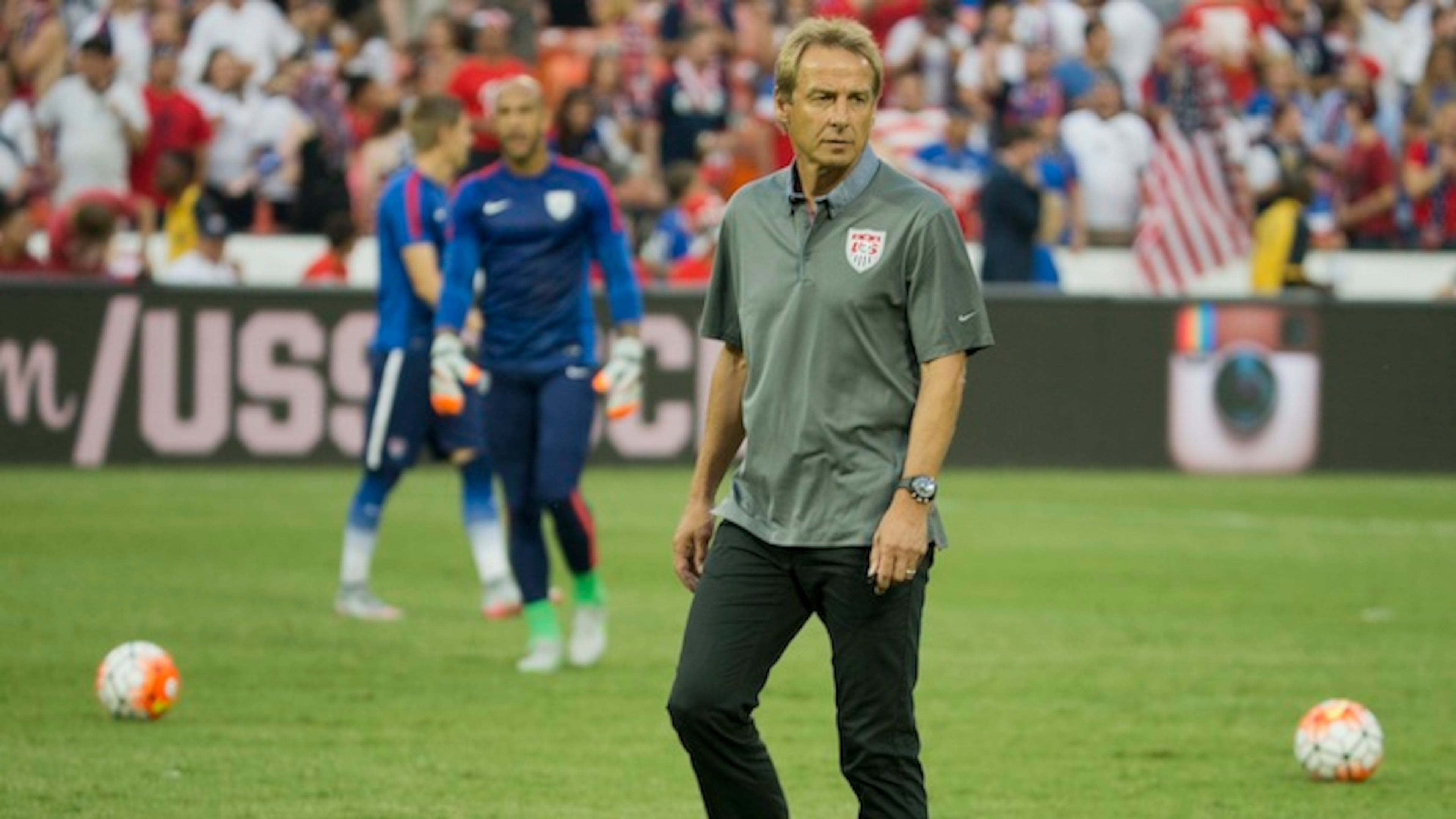 U.S. head soccer coach Jurgen Klinsmann watches his players warm up prior to start of an international friendly soccer match against Peru, Friday, Sept. 4, 2015, at RFK Stadium in Washington. (Pablo Martinez Monsivais/AP)