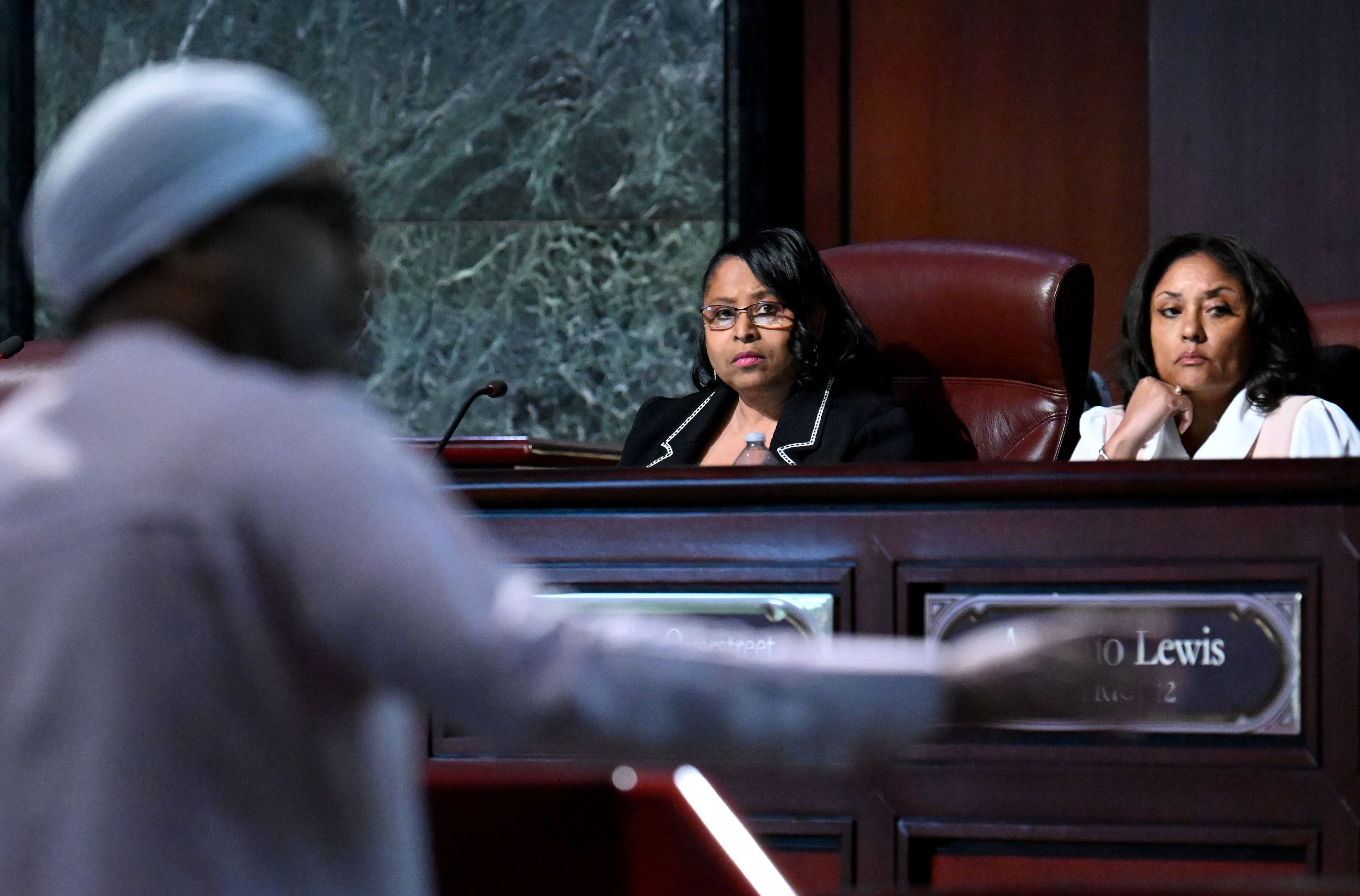 Council members Andrea Boone and Marci Collier Overstreet listen to a speaker during public comments at a City Council meeting g a council meeting at Atlanta City Hall, Thursday, January 23, 2025, in Atlanta. (Hyosub Shin/AJC)