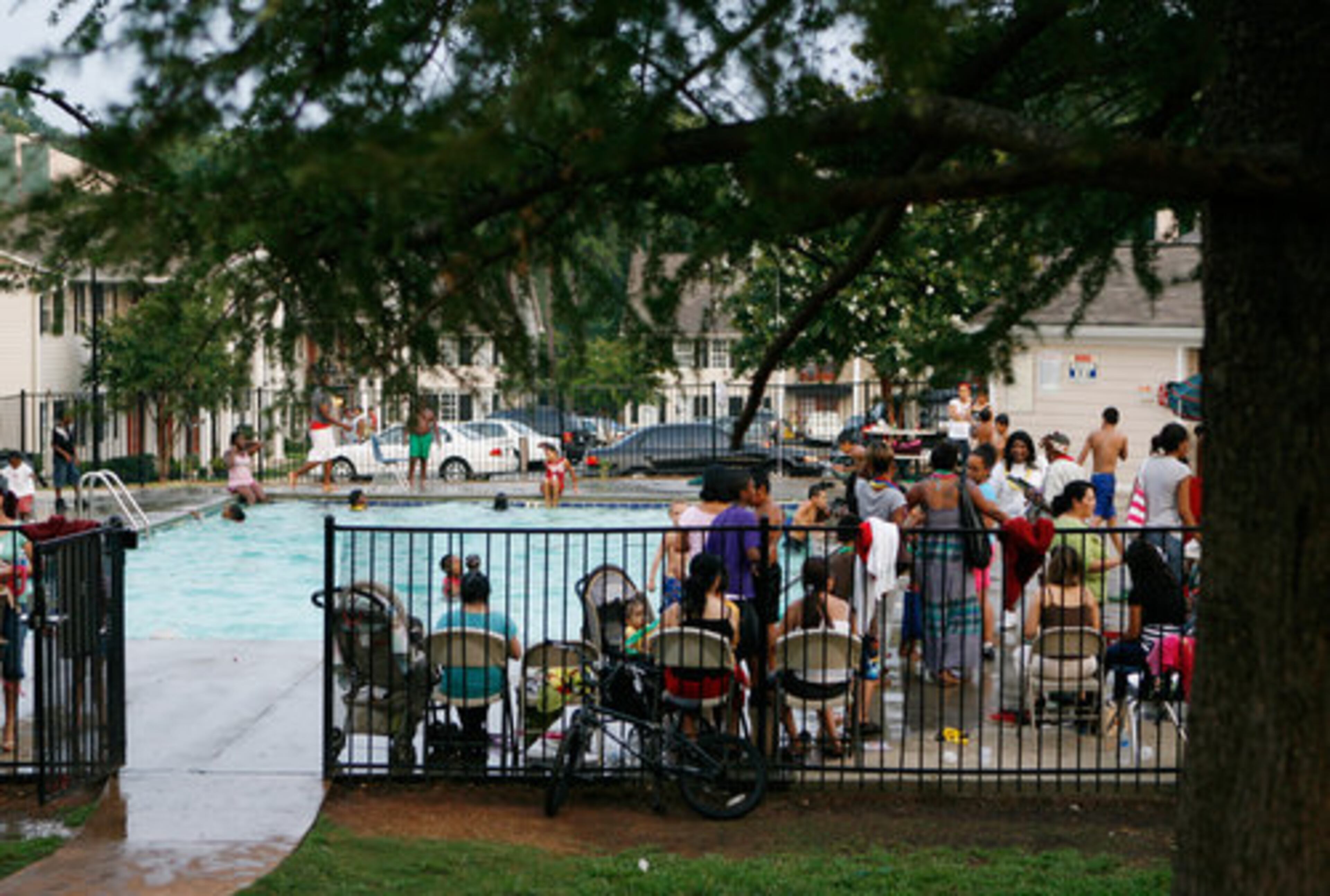 Recent local efforts and a five-year federal grant program have made a difference. Here, residents at the Casa Mia Trace apartments take part in a National Night Out party that brought together five apartment complexes.