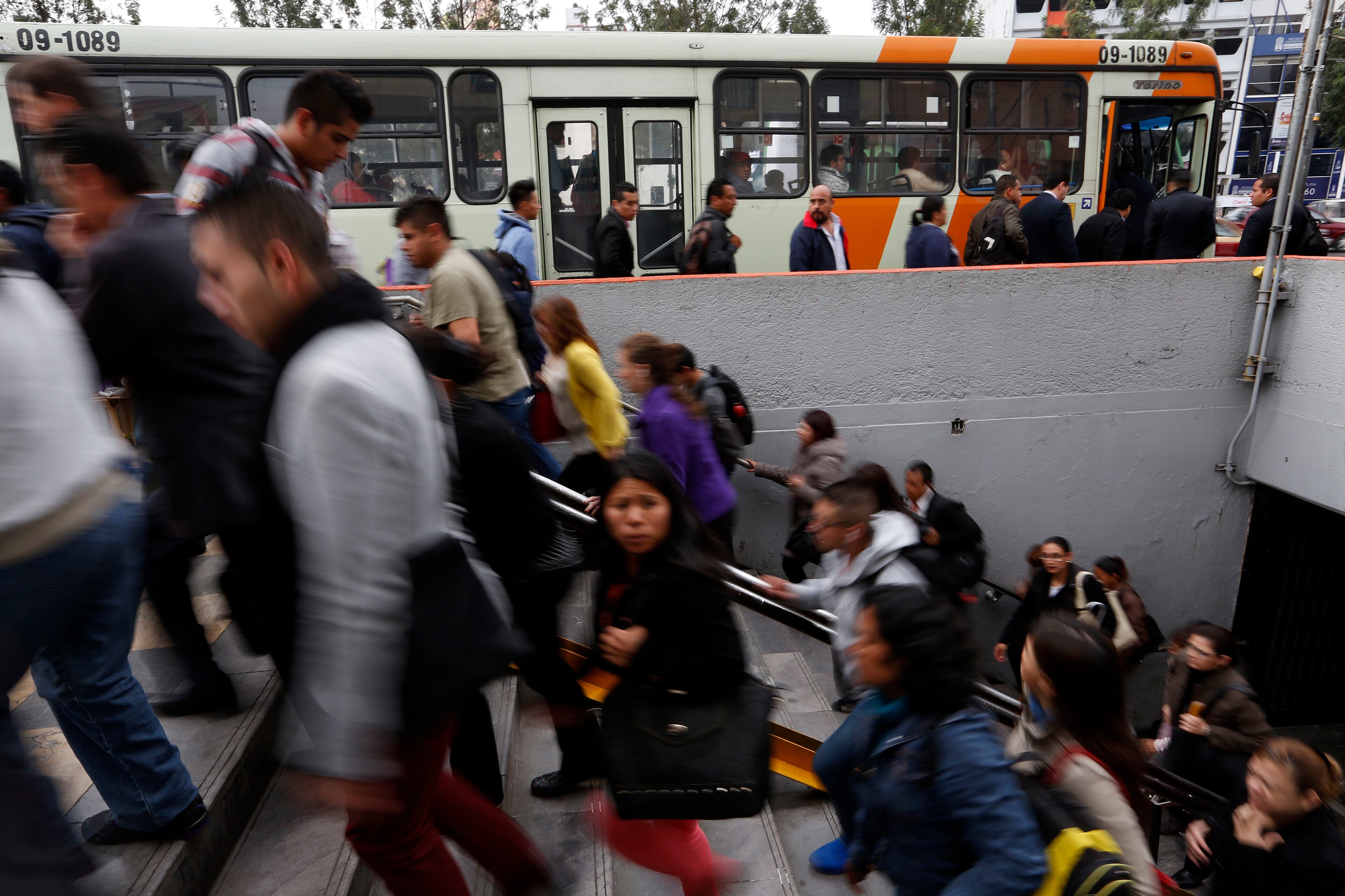 In this Wednesday, Sept. 17, 2014 photo, commuters exit the Sevilla subway station in Mexico City. (AP Photo/Moises Castillo)