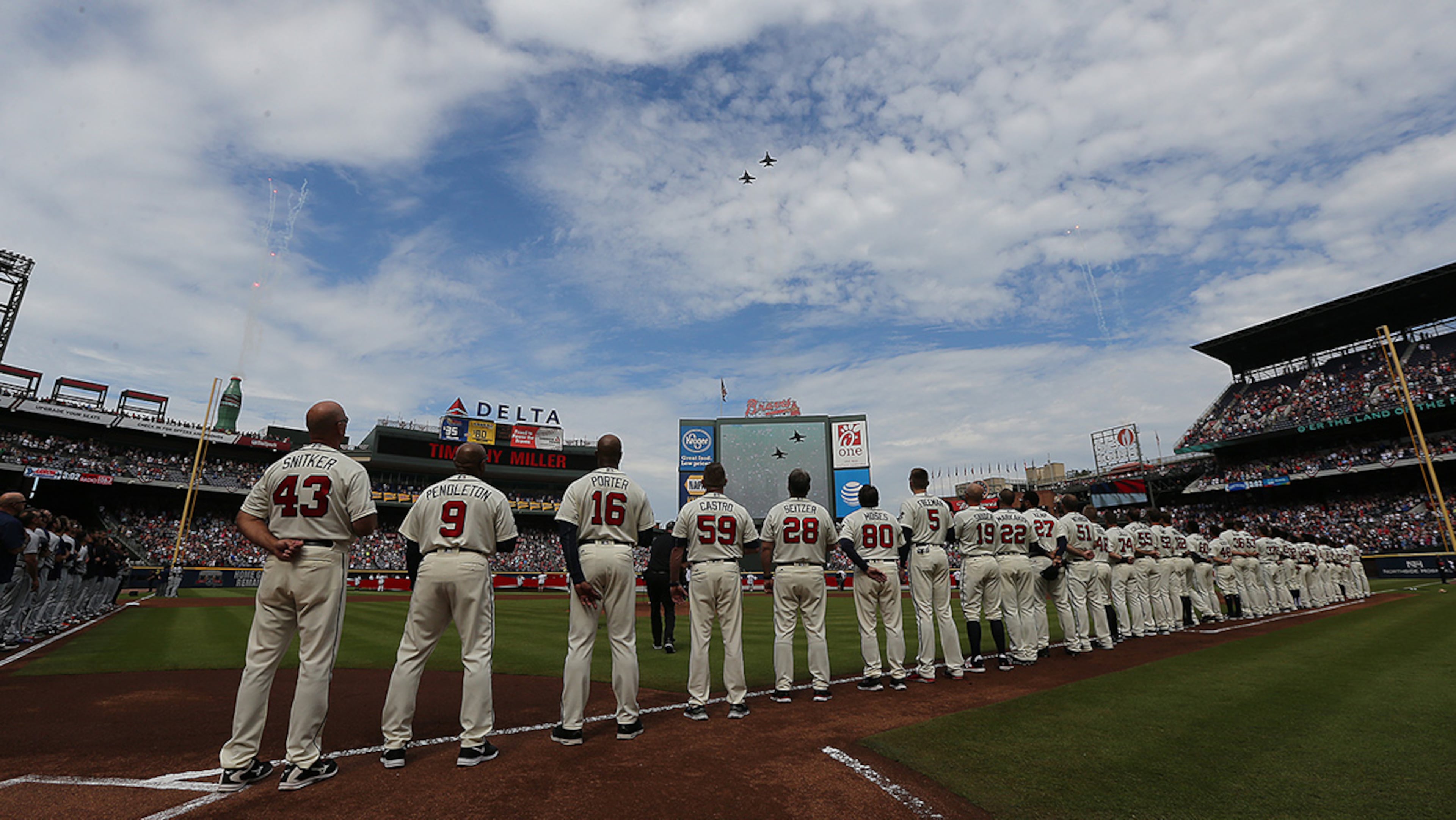October 02, 2016 Atlanta: The Braves, Tigers, and former Braves players line the field for a fly over to begin the final game at Turner Field on Sunday, Oct. 2, 2016, in Atlanta. The team will move to a new stadium in Cobb County for the 2017 season. Curtis Compton /ccompton@ajc.com