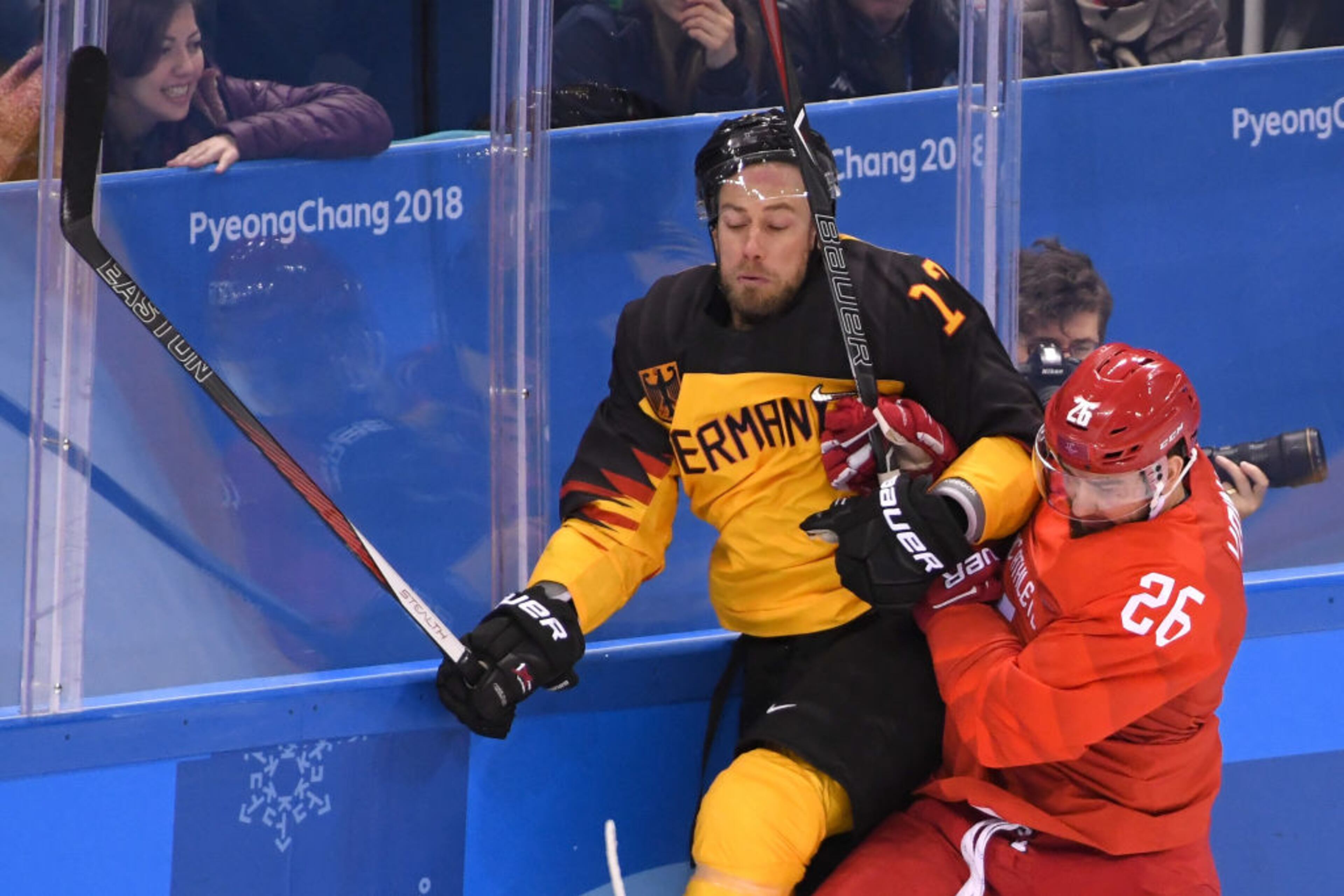 GANGNEUNG, SOUTH KOREA - FEBRUARY 25: Vyacheslav Voinov #26 of Olympic Athlete from Russia collides with Marcus Kink #17 of Germany in the second period during the Men's Gold Medal Game on day sixteen of the PyeongChang 2018 Winter Olympic Games at Gangneung Hockey Centre on February 25, 2018 in Gangneung, South Korea. (Photo by Harry How/Getty Images)