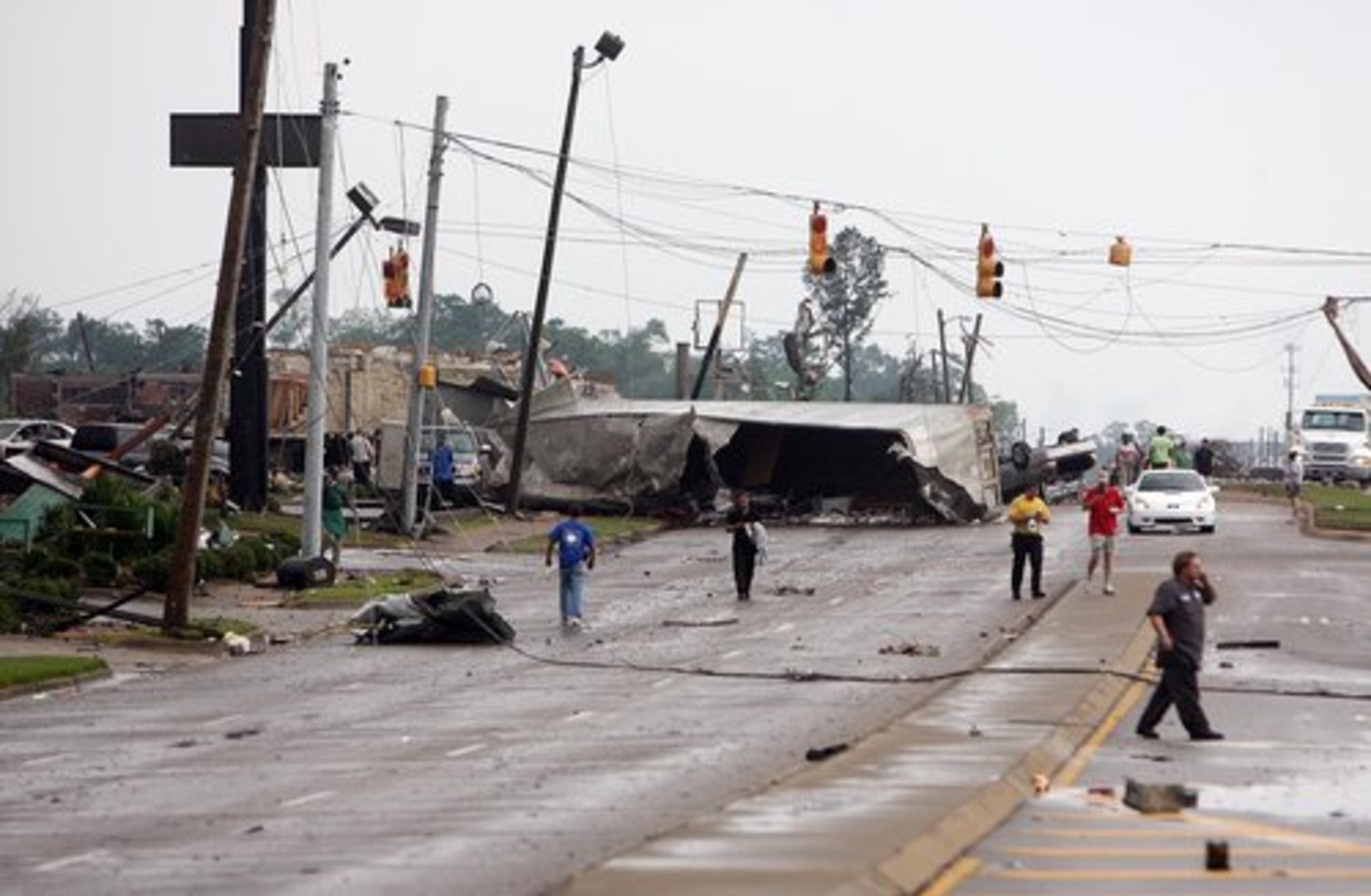 A semi-truck lies on its side on 15th Street after a tornado ripped through Tuscaloosa, Ala.