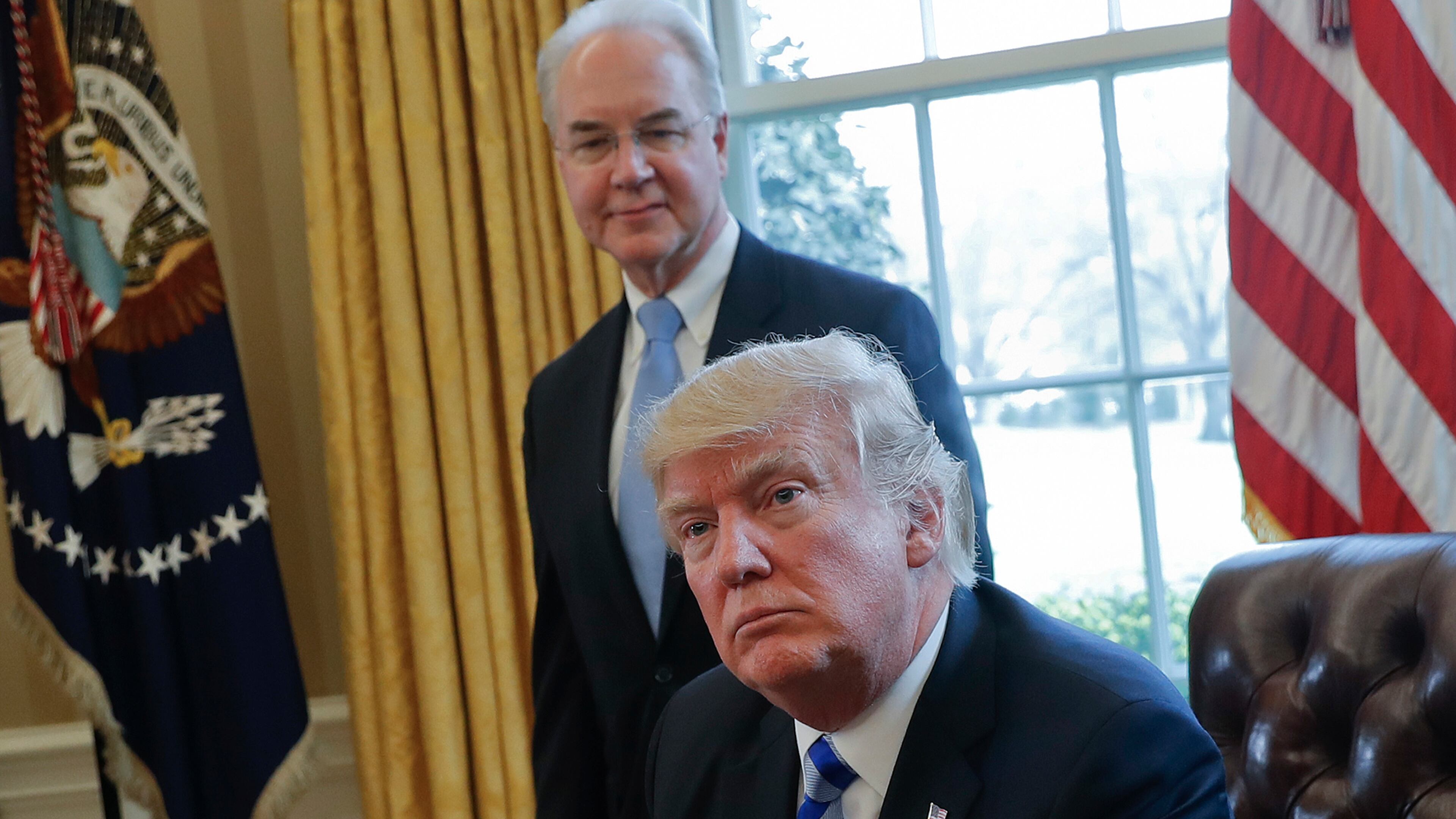 FILE - In this March 24, 2017 file photo, President Donald Trump with Health and Human Services Secretary Tom Price are seen in the Oval Office of the White House in Washington. Congress is launching a wide-ranging examination of air travel by high-ranking Trump administration officials. The House Oversight and Government Reform committee is following up on reports that health secretary Tom Price used pricey charters when cheaper commercial flights would have done. (AP Photo/Pablo Martinez Monsivais, File)