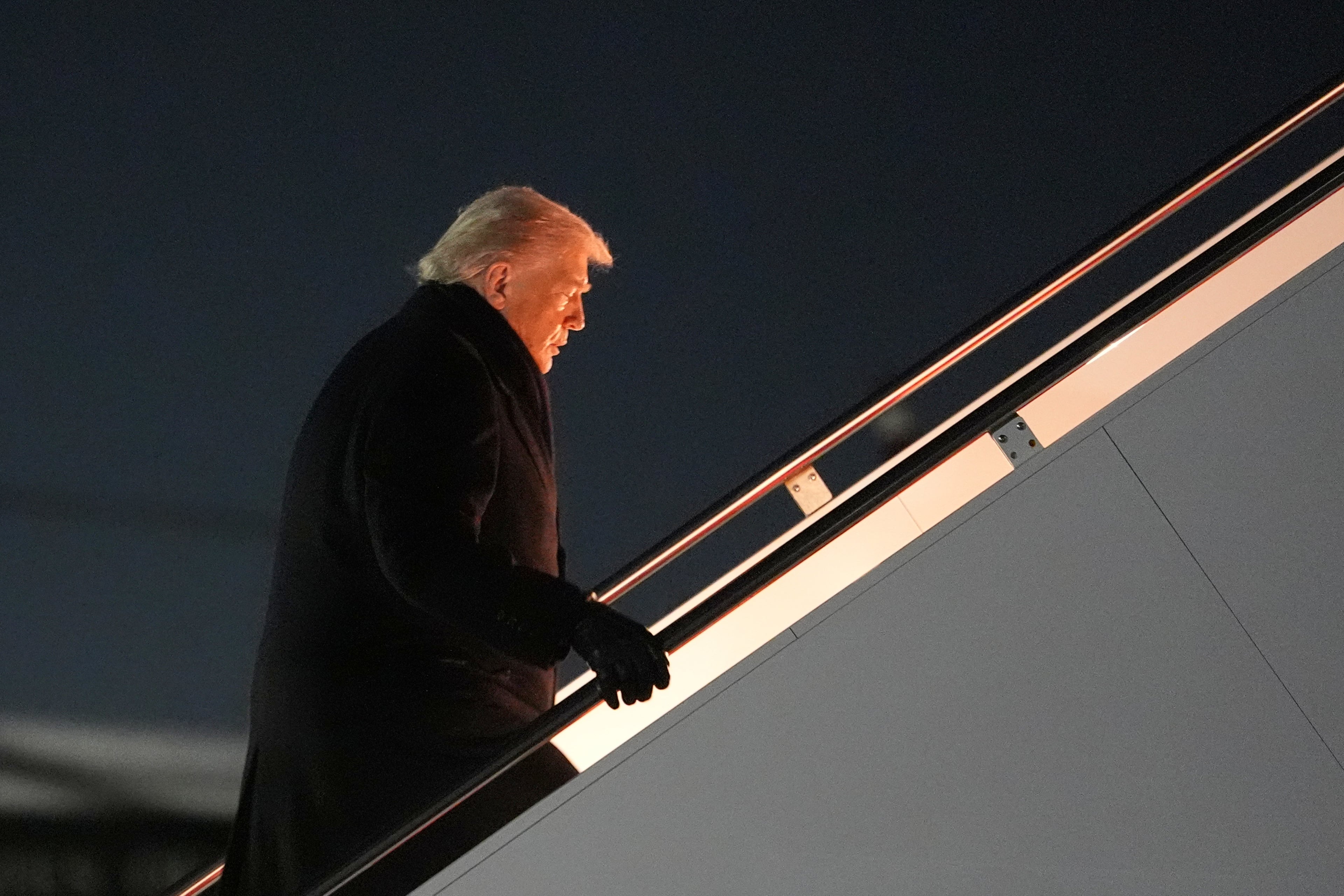 After a problem with the first plane, President Donald Trump took off overnight on another plane headed to Switzerland. (Evan Vucci/AP)