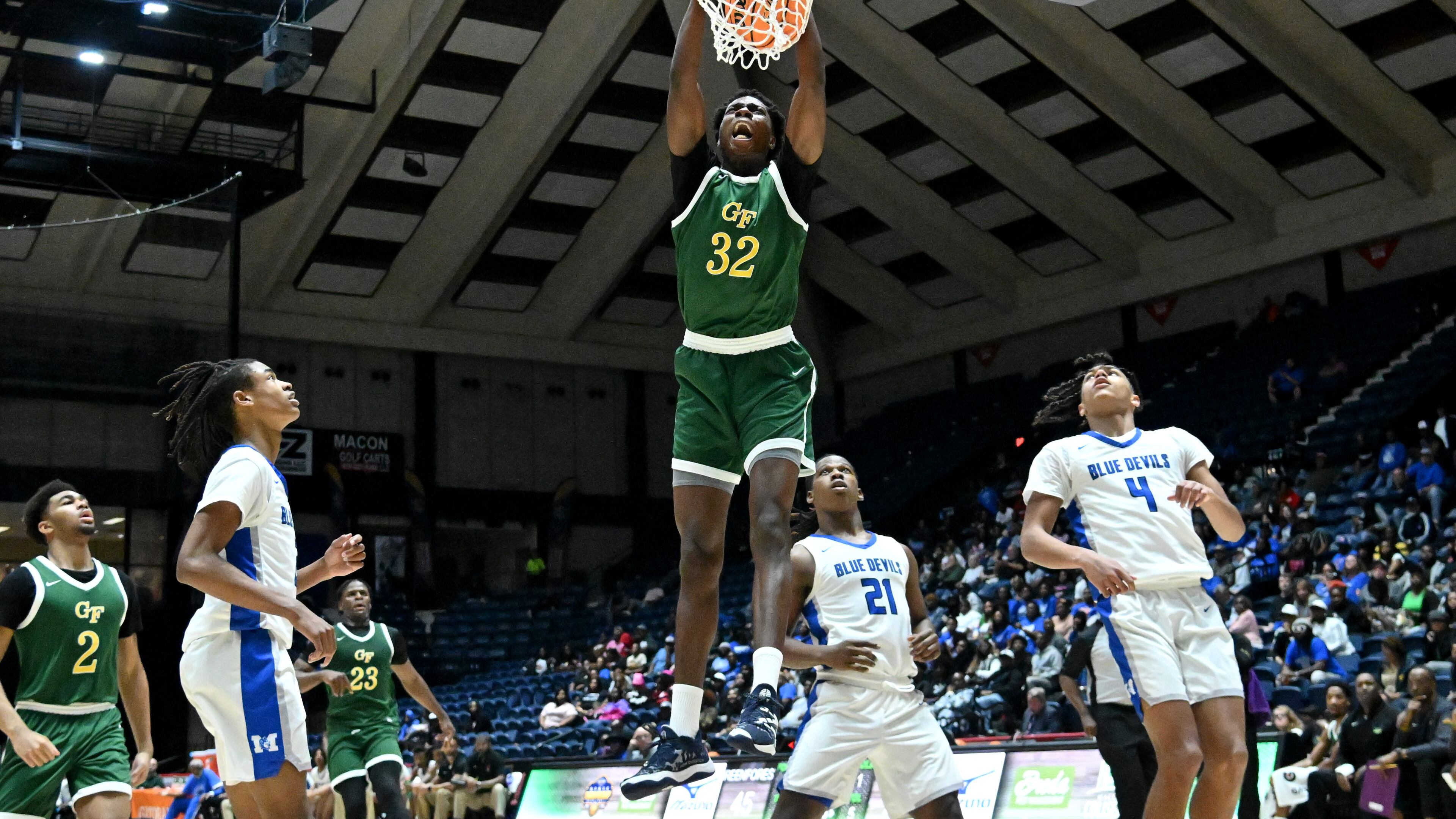 Greenforest's Daniel Daramola (32) dunks the ball against Manchester during the second half of GHSA Basketball Class A Division II Boy’s State Championship game at the Macon Centreplex, Wednesday, Mar. 6, 2024, in Macon. Greenforest Christian won 68-39 over Manchester. (Hyosub Shin / Hyosub.Shin@ajc.com)