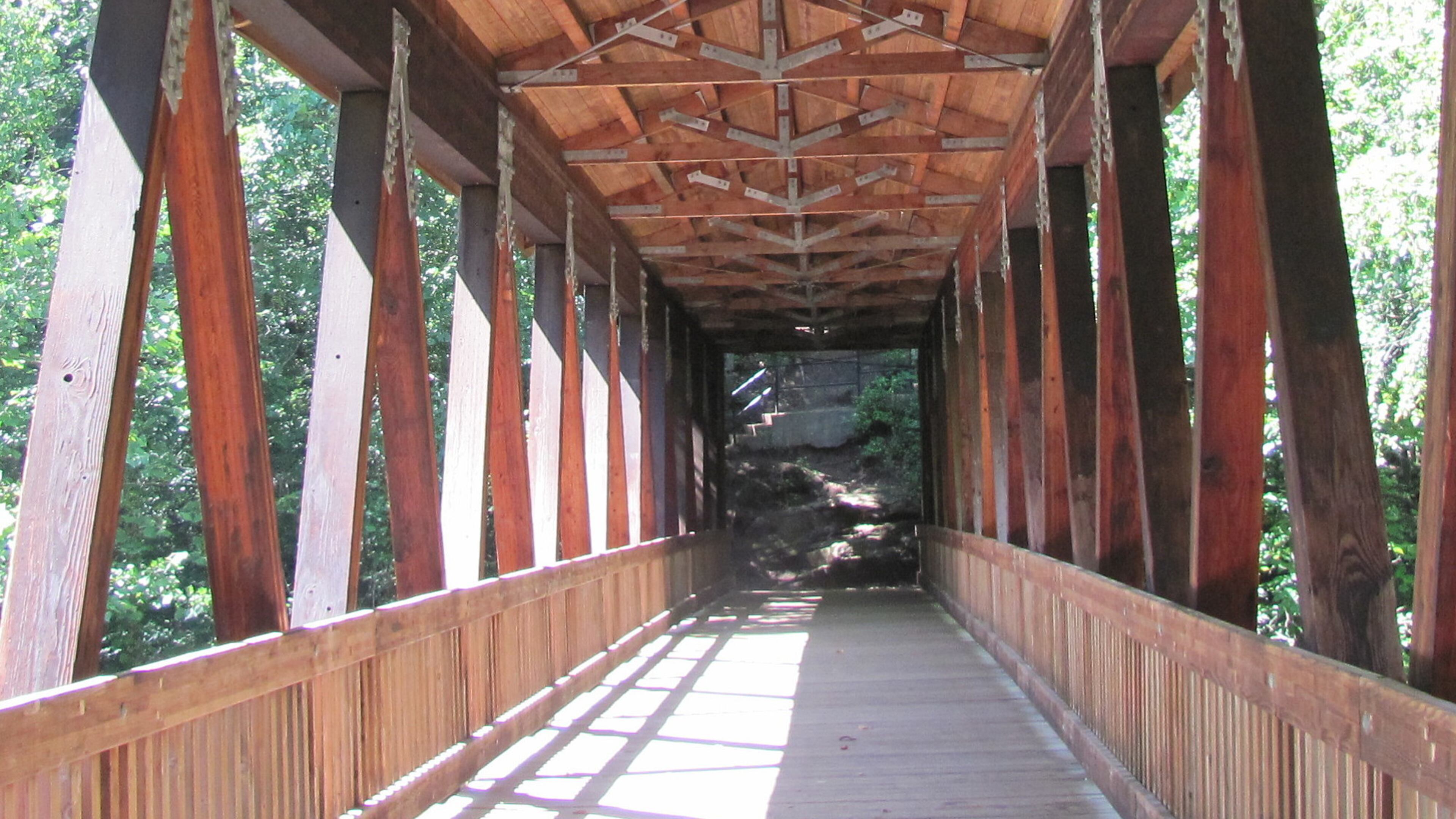 A covered bridge is one of the cool structures on the Vickery Creek Trail.