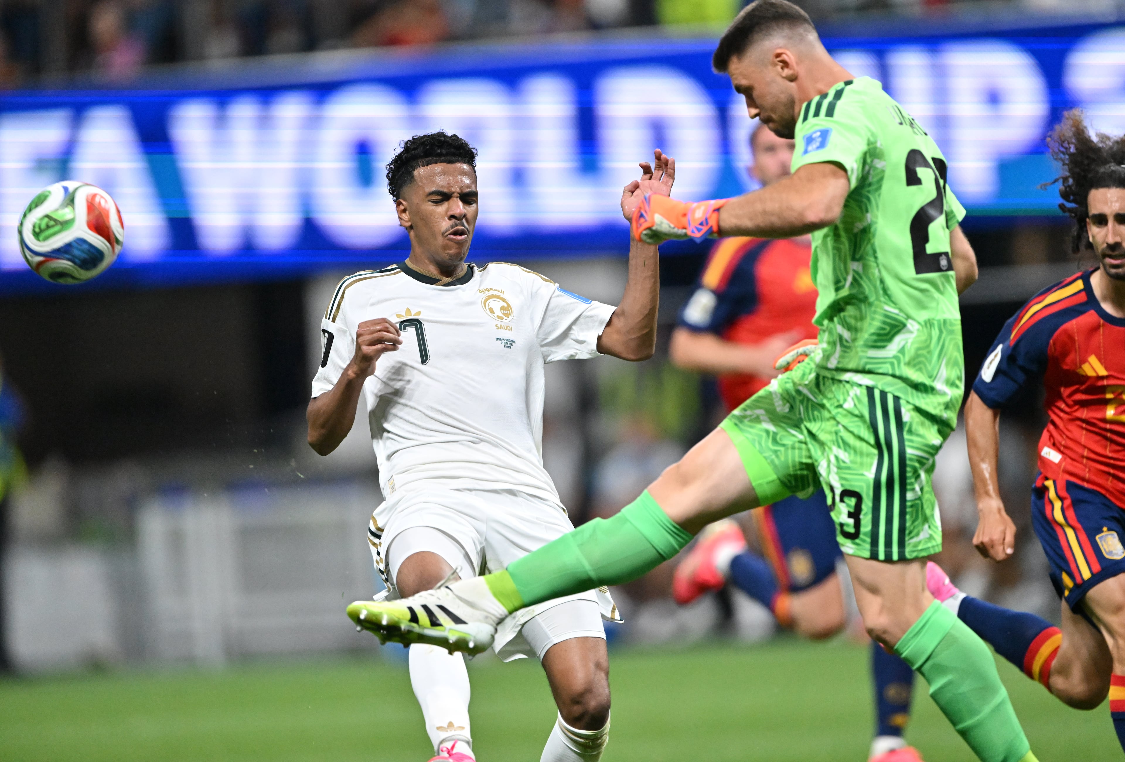 Spain goalkeeper Unai Simon (right) kicks the ball away from Saudi Arabia's Musab Al-Juwayr during the first half of the Spain vs. Saudi Arabia World Cup match Sunday, June 21, 2026, at Atlanta Stadium. (Hyosub Shin/AJC)
