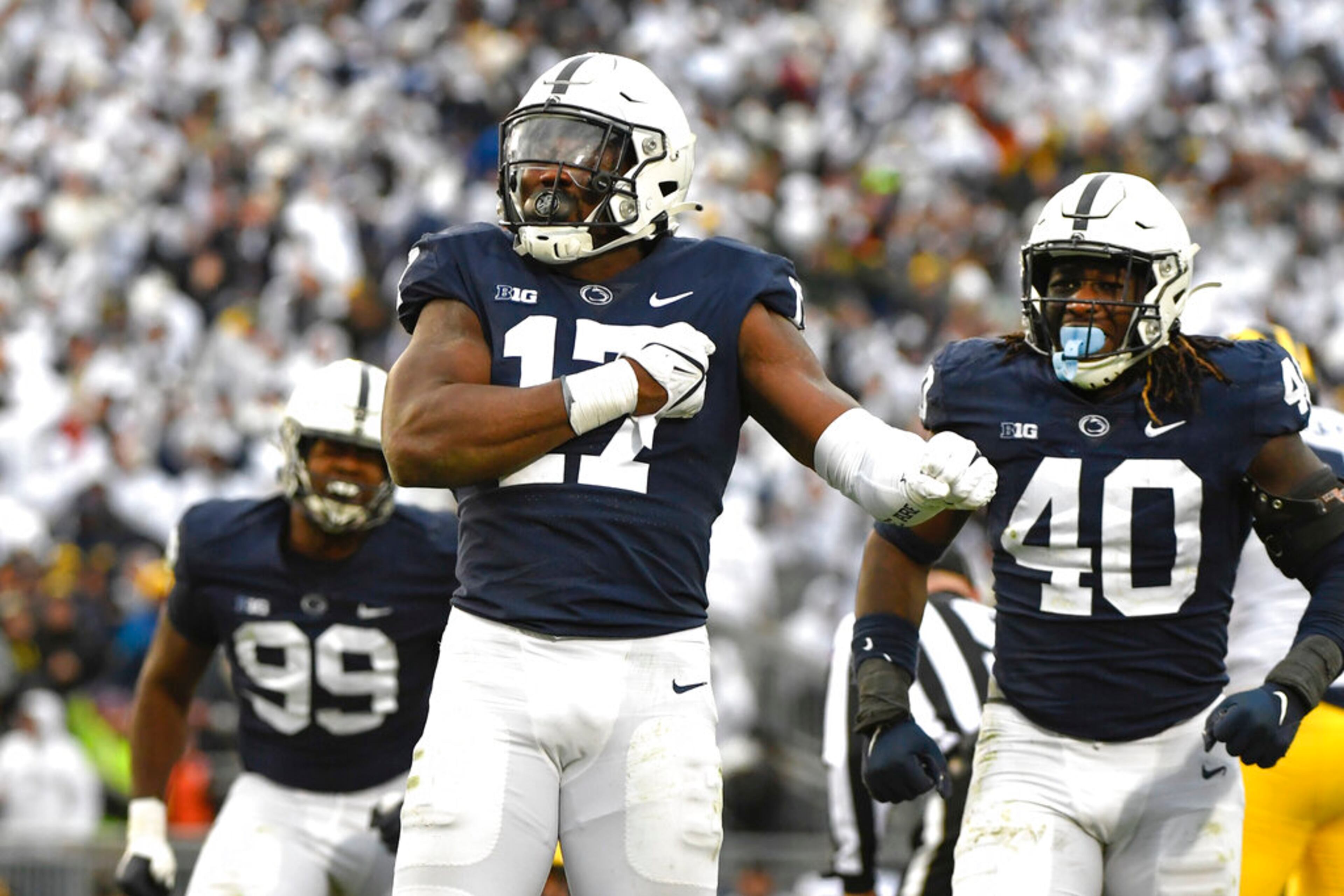 Penn State defensive end Arnold Ebiketie (17) celebrates after forcing Michigan quarterback Cade McNamara (12) to fumble during an NCAA college football game in State College, Pa.on Saturday, Nov. 13, 2021. (AP Photo/Barry Reeger)