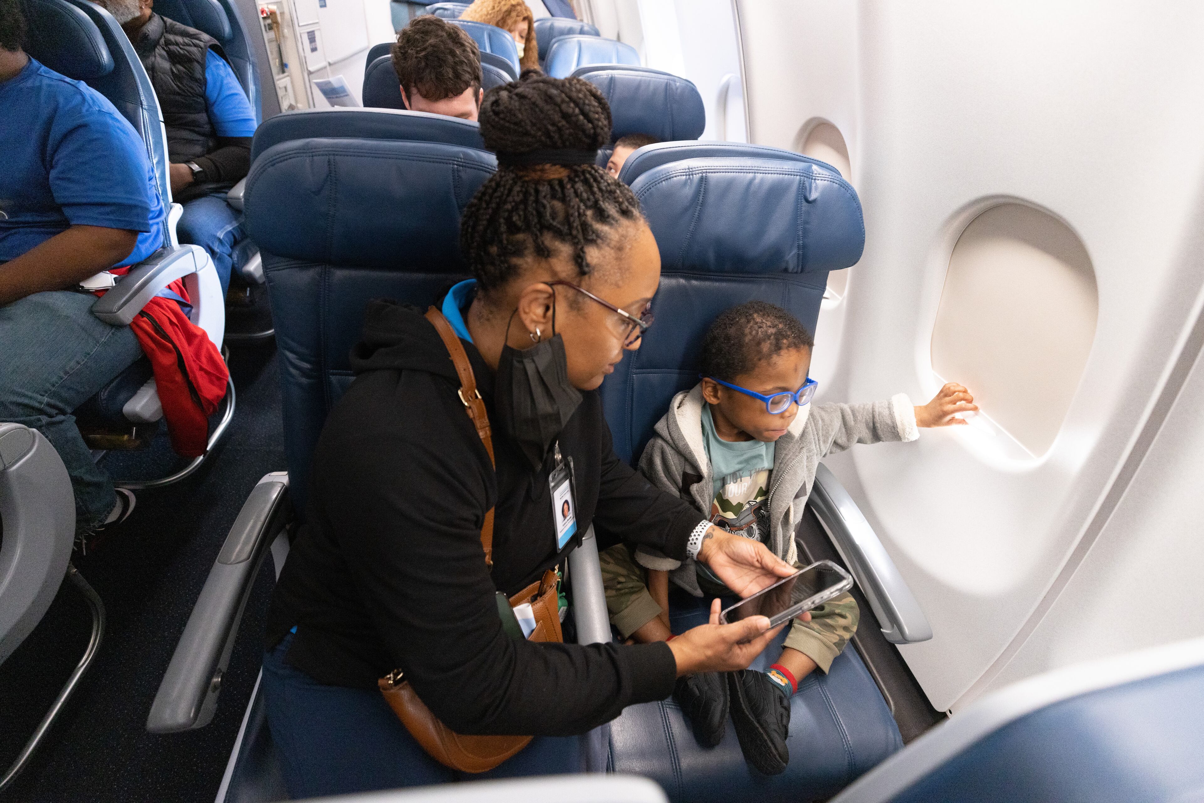I’m Amari Crawford sits with this therapist Valerie Biamby on a Delta airplane jet during a Wings For All event at the Hartsfield-Jackson Atlanta International Airport Tuesday, April 11, 2023 (Steve Schaefer/steve.schaefer@ajc.com)