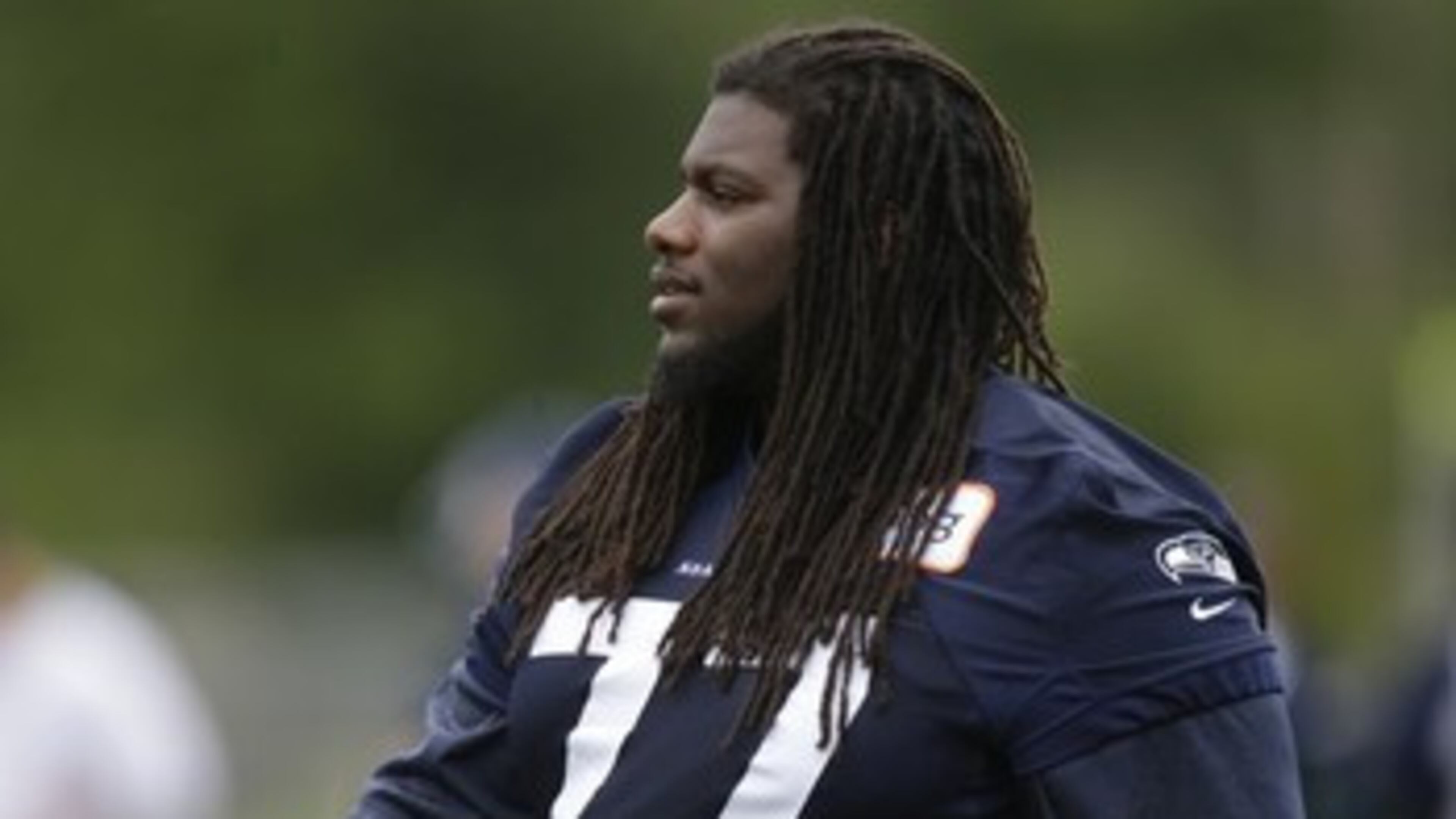 Seattle Seahawks guard James Carpenter stands on the sidelines during a practice drill, Tuesday, May 28, 2013, at an NFL football organized team activity in Renton, Wash. (AP Photo/Ted S. Warren)