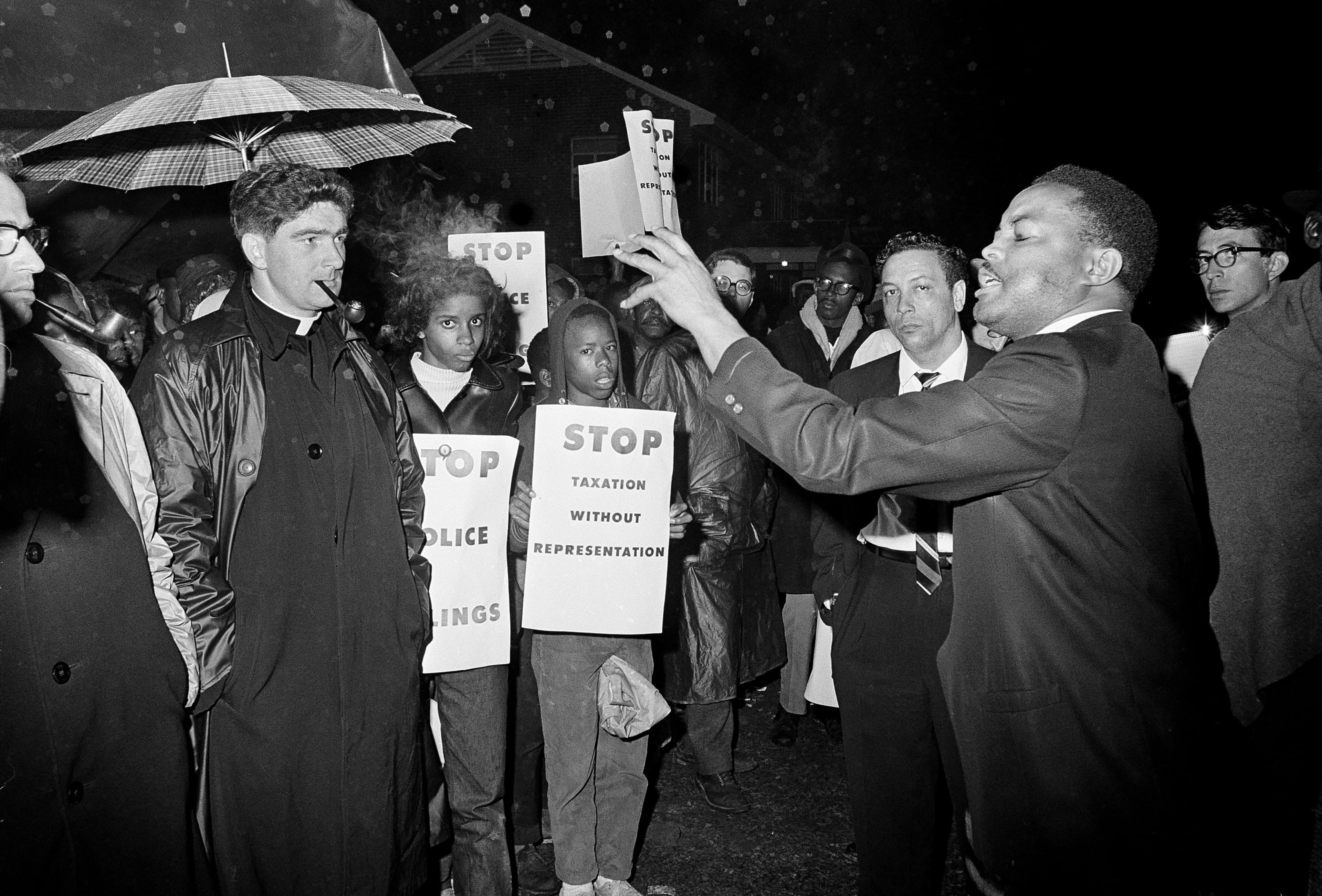 Hosea Williams, civil rights activist, tells demonstrators in Selma, Ala., that they will march to the courthouse "come hell or high water," Feb. 13, 1965.