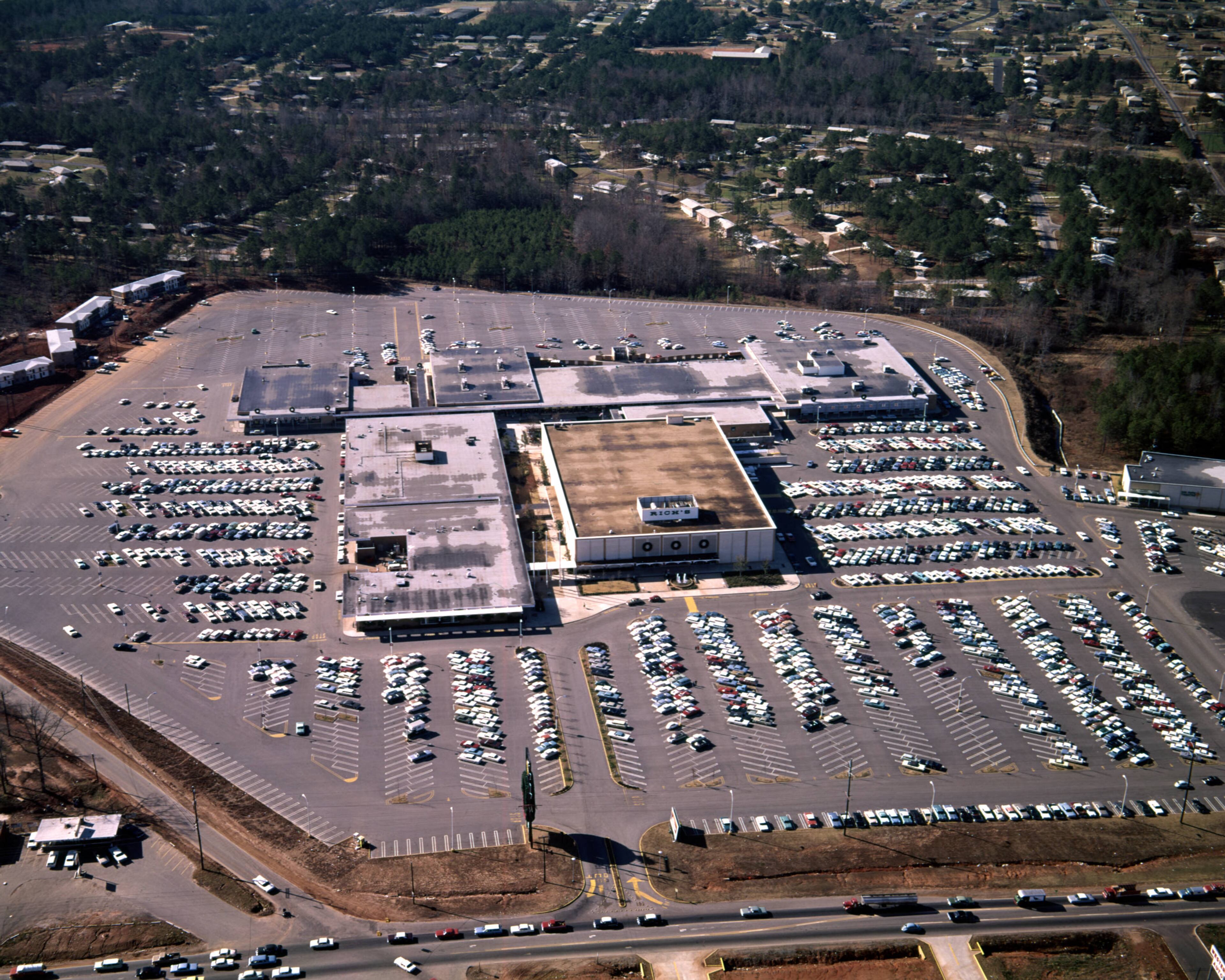 Aerial view of the Cobb County Shopping Center and its surrounding parking lot, with a view towards Rich's and Grant's, Smyrna, Georgia, December 21, 1965.