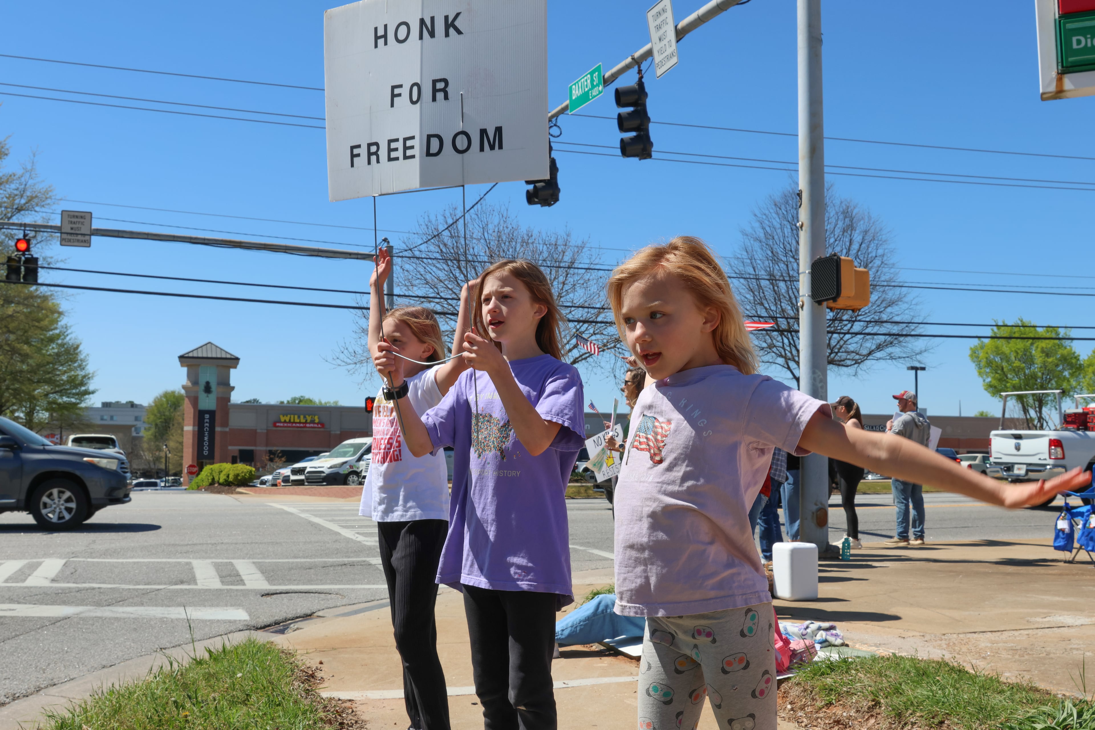 Kids participate in a protest in Athens on Saturday, March 28, 2026. Protesters gathered in 10 different locations around Georgia’s Congressional District 10, leading up to a “Democracy Fair” at Athens’ Bishop Park as part of a nationwide day of “No Kings” demonstrations. Organizers estimate that a few thousand people participated, many of them first-time protesters. (C.J. Bartunek for the AJC)