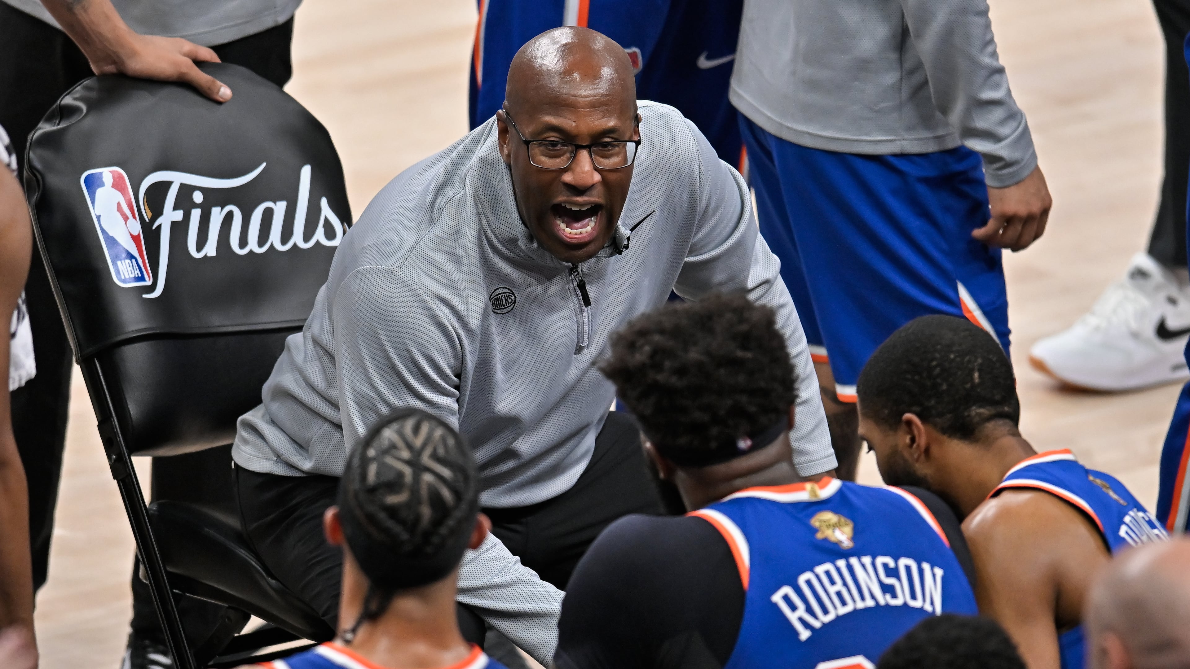 New York Knicks head coach Mike Brown talks with his team during a time out during the first half of Game 5 of the NBA Finals basketball series against the San Antonio Spurs, Saturday, June 13, 2026, in San Antonio. (AP Photo/Darren Abate)