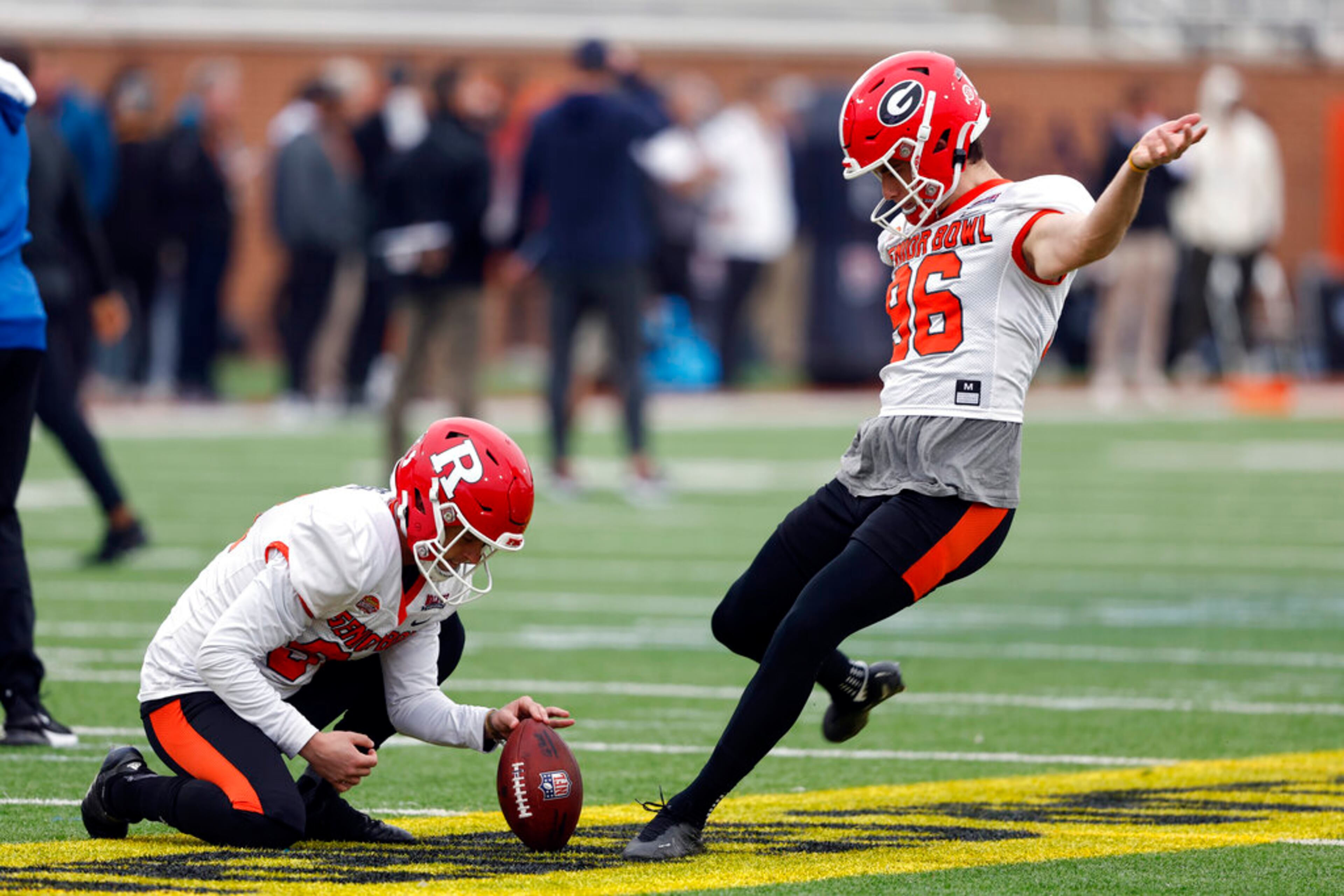 American place kicker Jack Podlesny of Georgia (96) and American Adam Korsak of Rutgers (94) run through drills during practice for the Senior Bowl NCAA college football game Thursday, Feb. 2, 2023, in Mobile, Ala.. (AP Photo/Butch Dill)