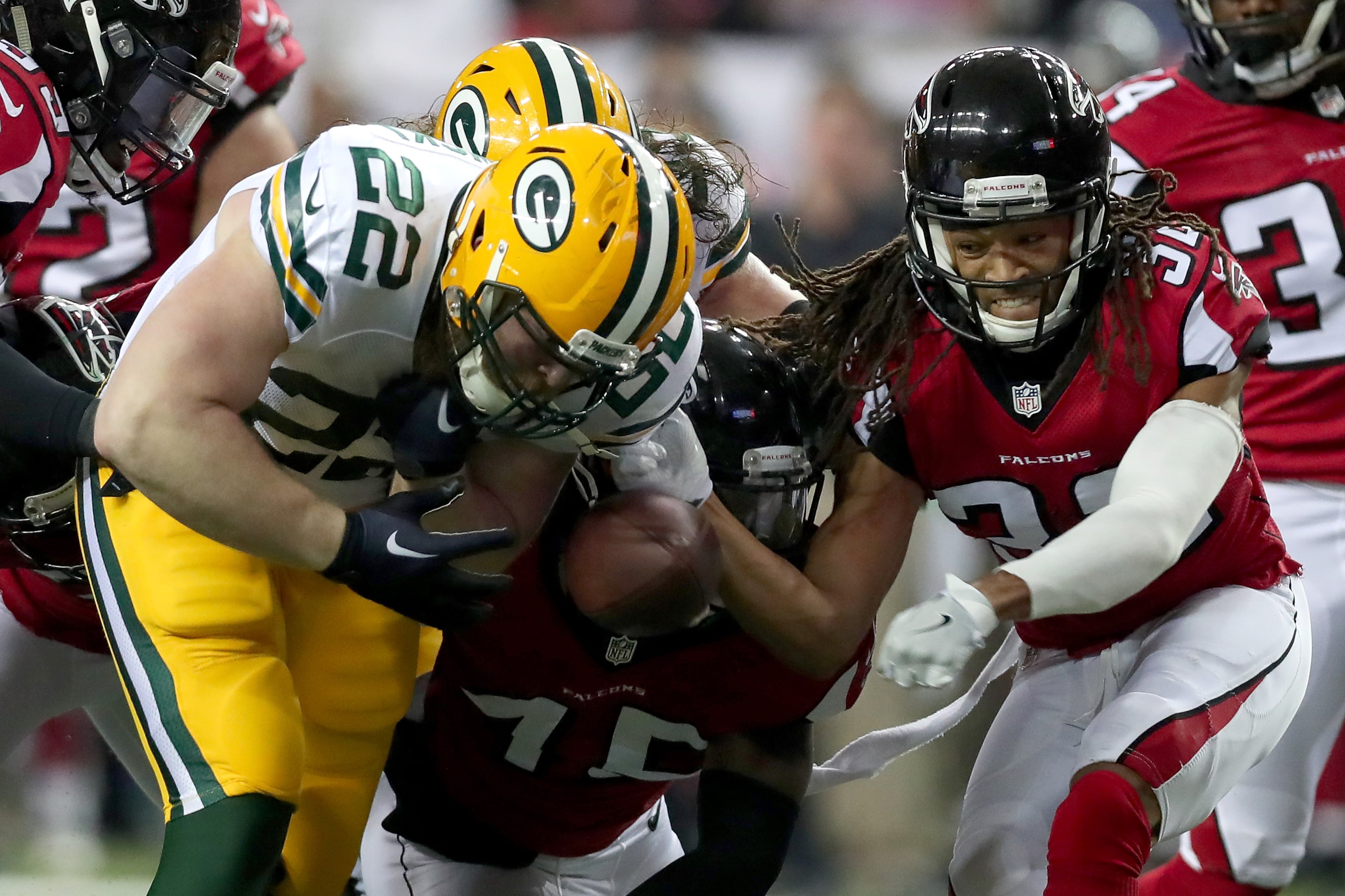 ATLANTA, GA - JANUARY 22: Aaron Ripkowski #22 of the Green Bay Packers fumbles the ball in the second quarter after contact with Jalen Collins #32 of the Atlanta Falcons in the NFC Championship Game at the Georgia Dome on January 22, 2017 in Atlanta, Georgia. (Photo by Tom Pennington/Getty Images)