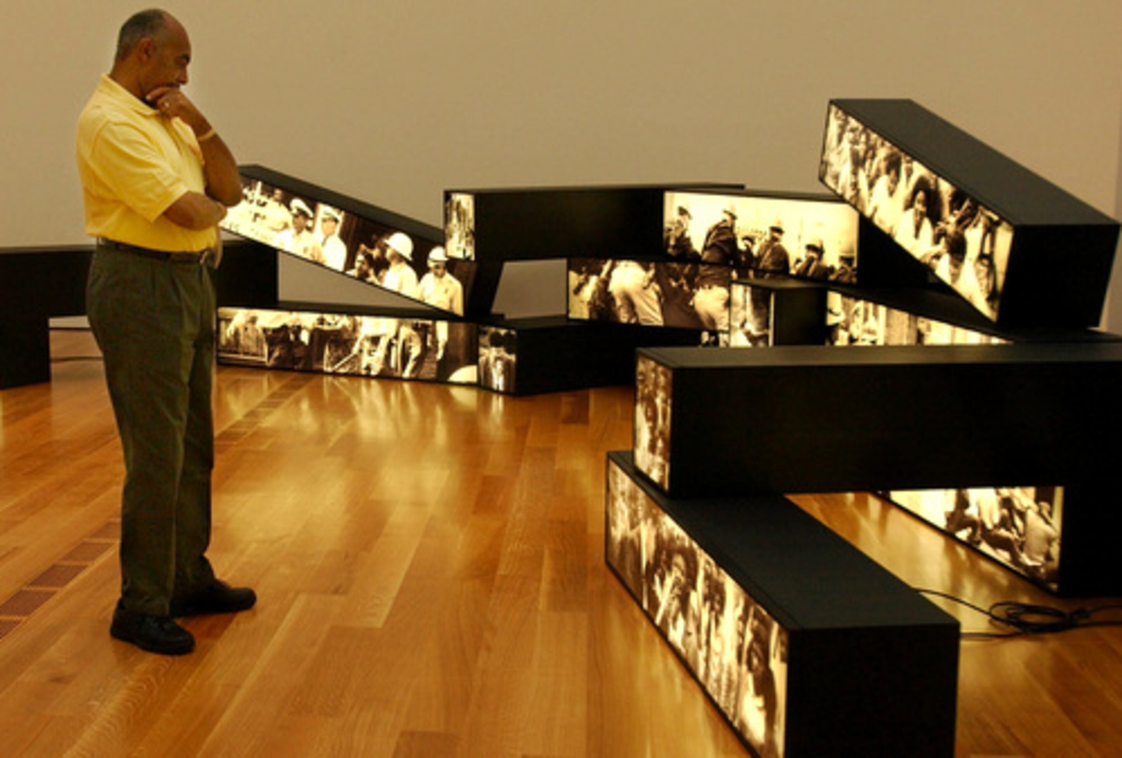 A visitor takes in artwork by Alfredo Jaar in the Anne Cox Chambers Wing at the High Museum of Art. The museum is now previewing some images from an exhibit that opens June 7, called "Road to Freedom: Photographs of the Civil Rights Movement, 1956-1968."