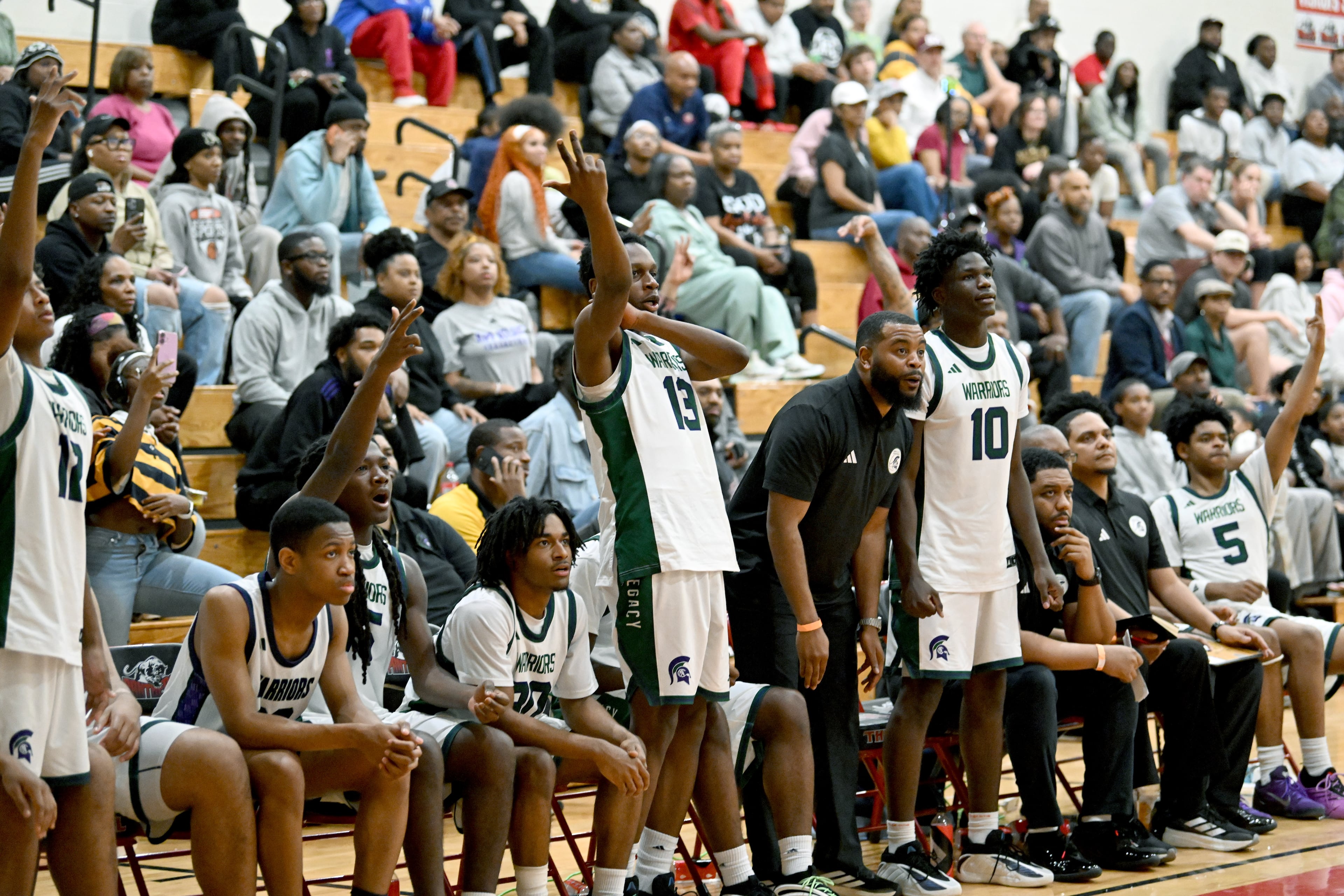 KIPP Atlanta Collegiate players react during Region 5AA Championship game at Therrell High School, Thursday, Feb. 19, 2026, in Atlanta. Holy Innocents Episcopal won 56-46 over KIPP Atlanta Collegiate. (Hyosub Shin/AJC)
