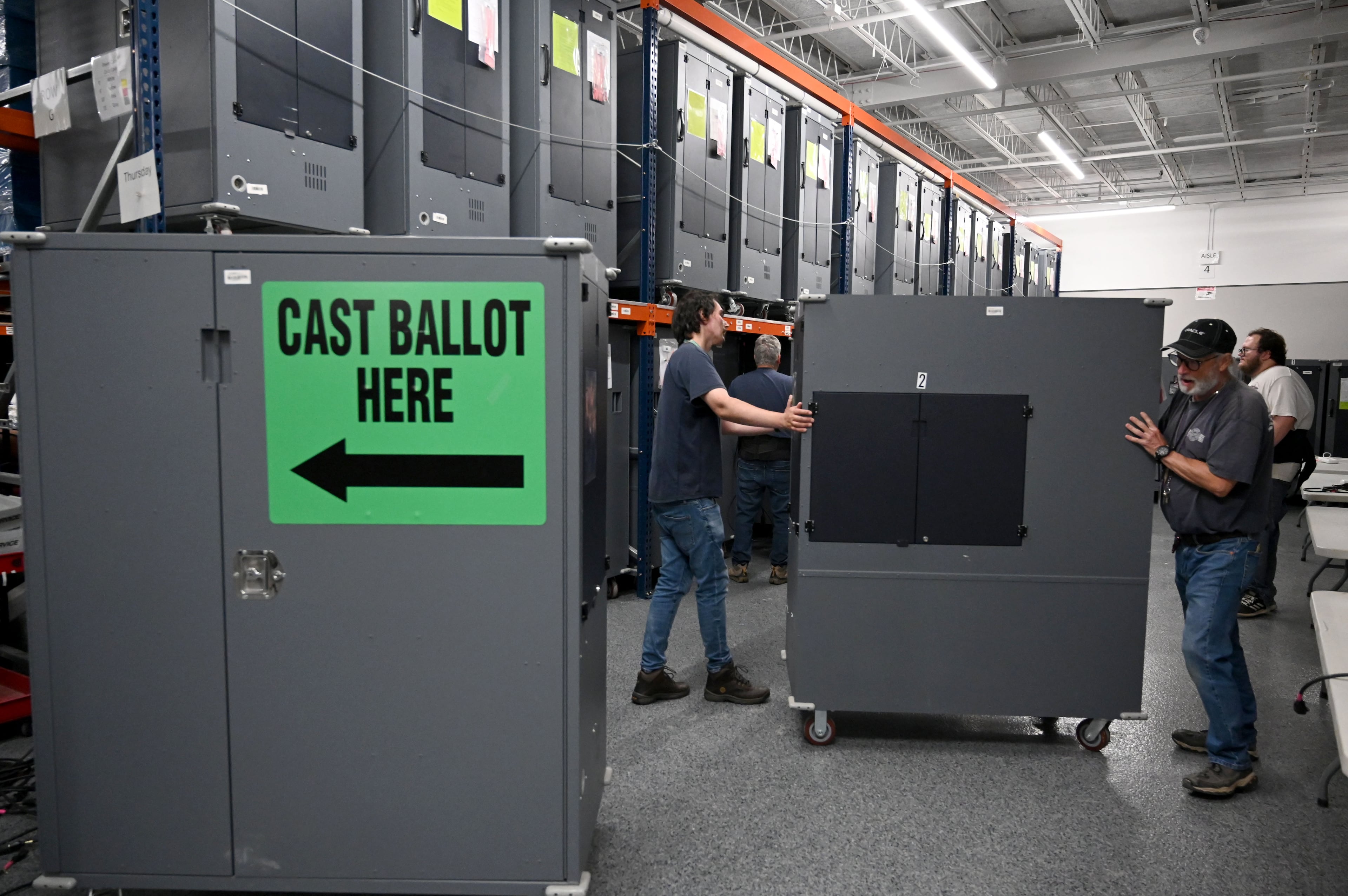 Georgia’s election workers brace for a tense midterm season