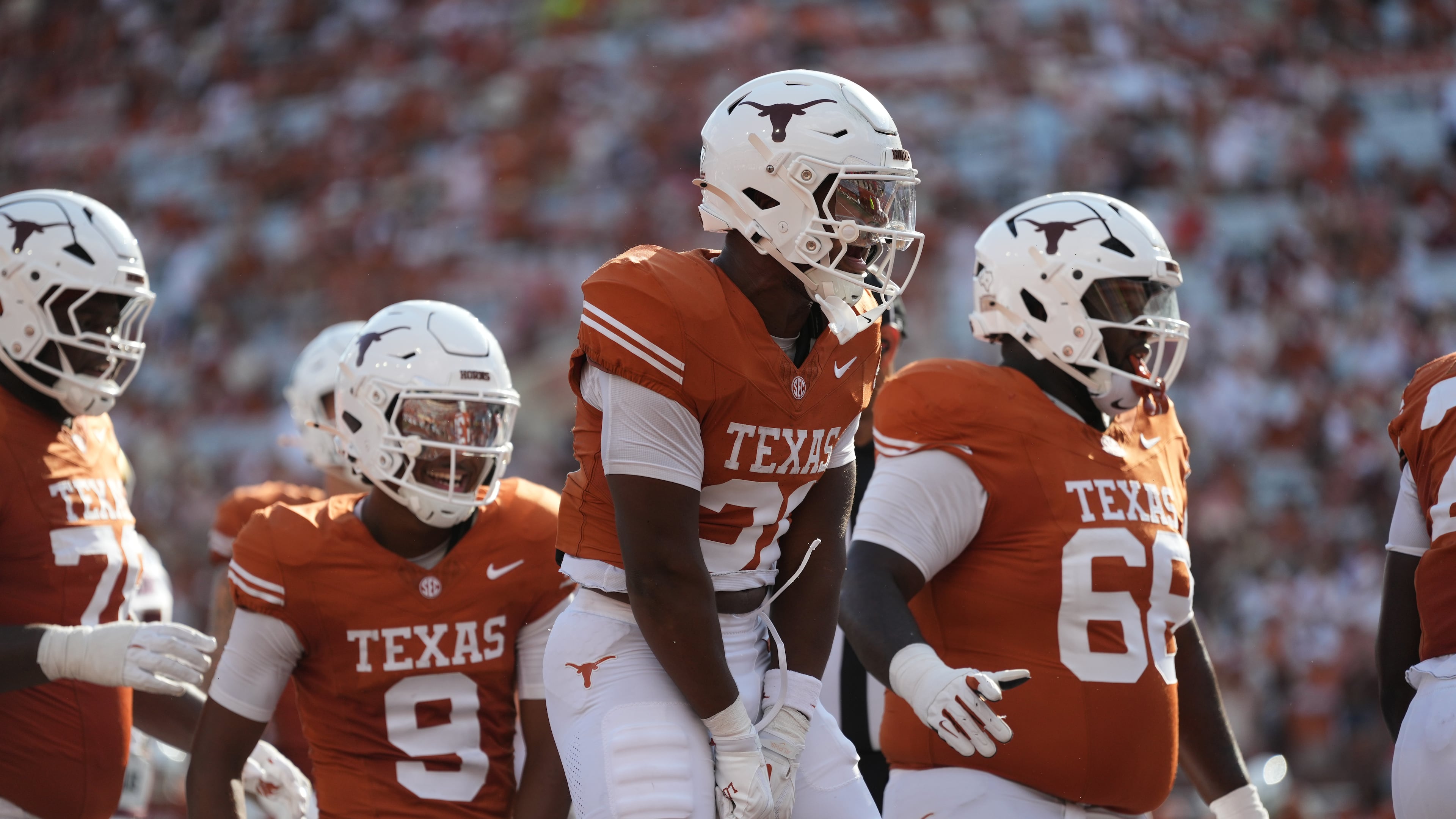 Texas running back James Simon (31) celebrates with teammates after scoring a touchdown against Texas State during the second half of an NCAA college football game in Austin, Texas, Saturday, Sept. 5, 2026. (AP Photo/Eric Gay)