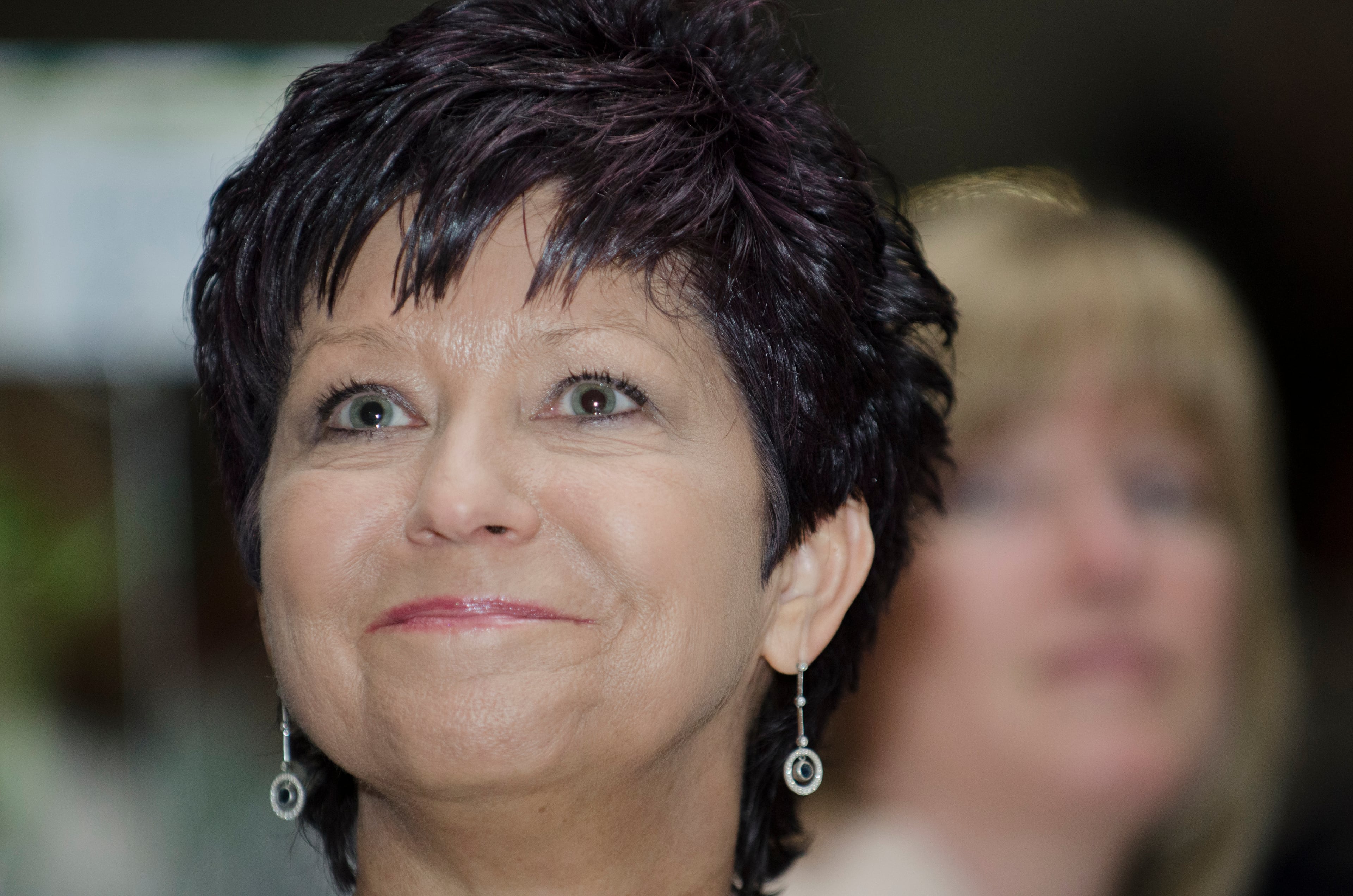 Kay Hall winner of Celebrating Nurses AJC Jobs Nursing Excellence Awards watches her video documentary the awards luncheon Tuesday, May 6, 2014 at the Cobb Galleria. (Photo by Barry Williams/Special)