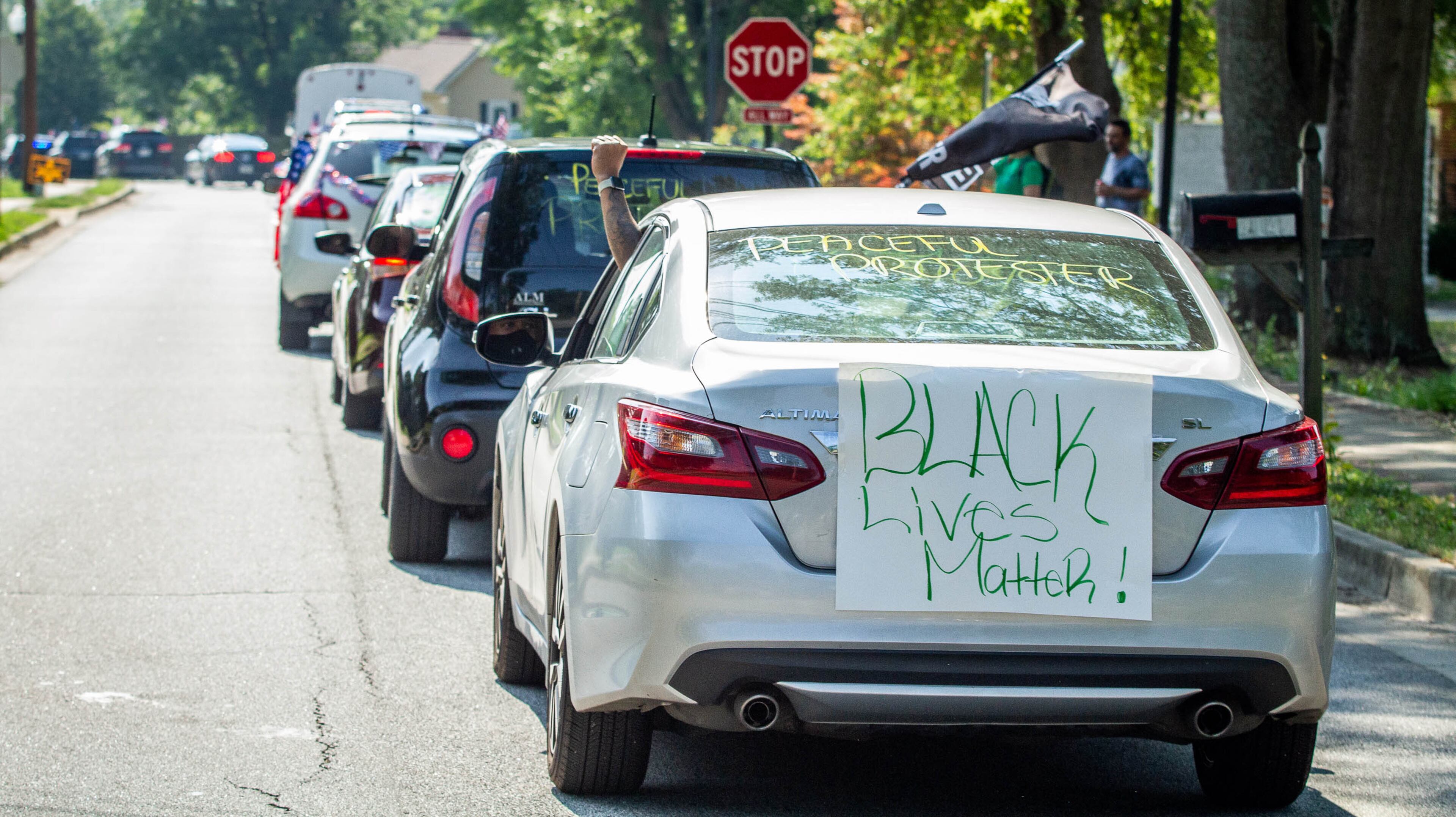 The 4th of July drive-by parade leaves the Coach George E. Ford Center in Powder Springs on Saturday, July 4, 2020. STEVE SCHAEFER FOR THE ATLANTA JOURNAL-CONSTITUTION