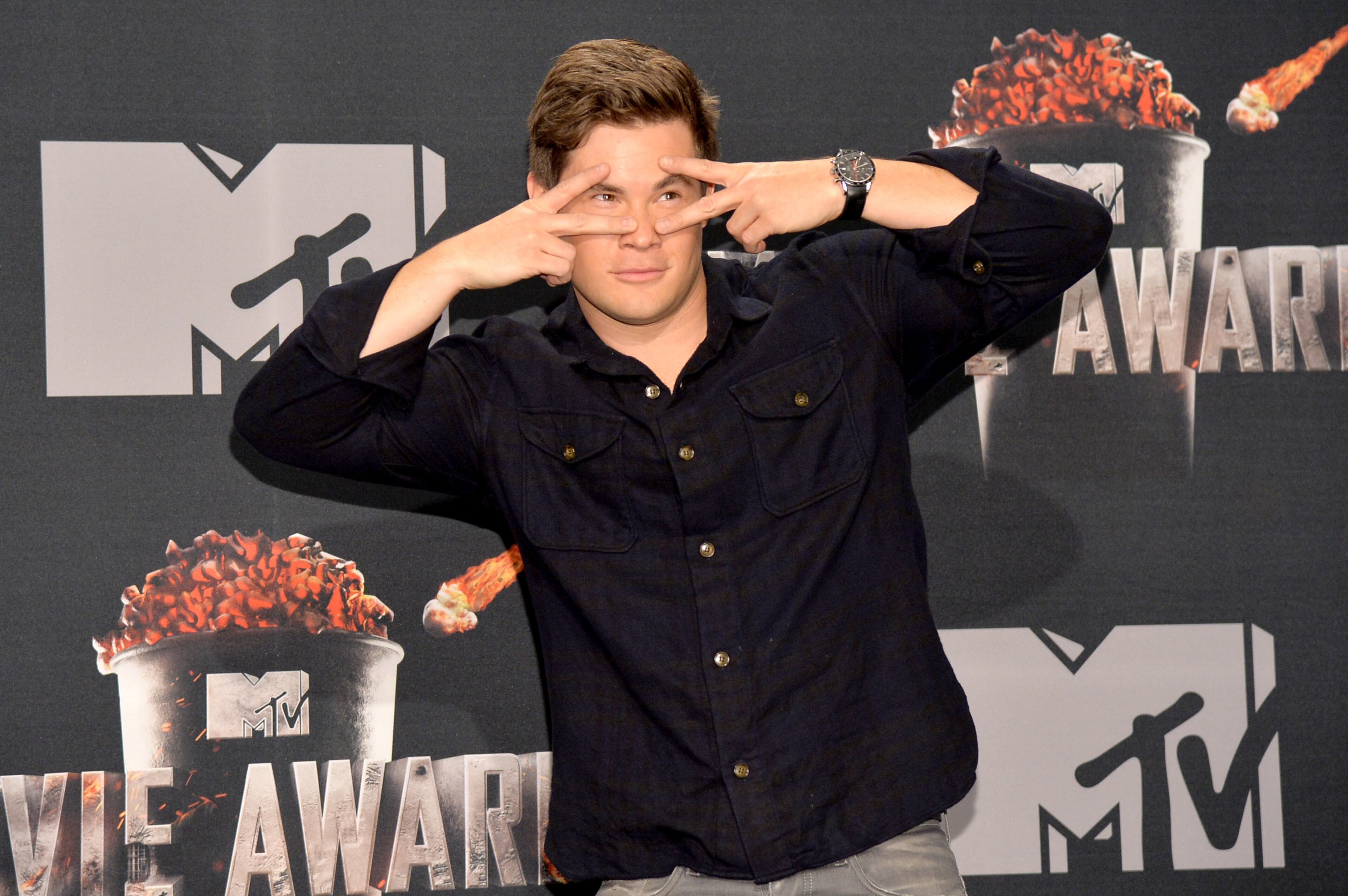 LOS ANGELES, CA - APRIL 13: Actor Adam DeVine poses in the press room during the 2014 MTV Movie Awards at Nokia Theatre L.A. Live on April 13, 2014 in Los Angeles, California. (Photo by Michael Buckner/Getty Images)