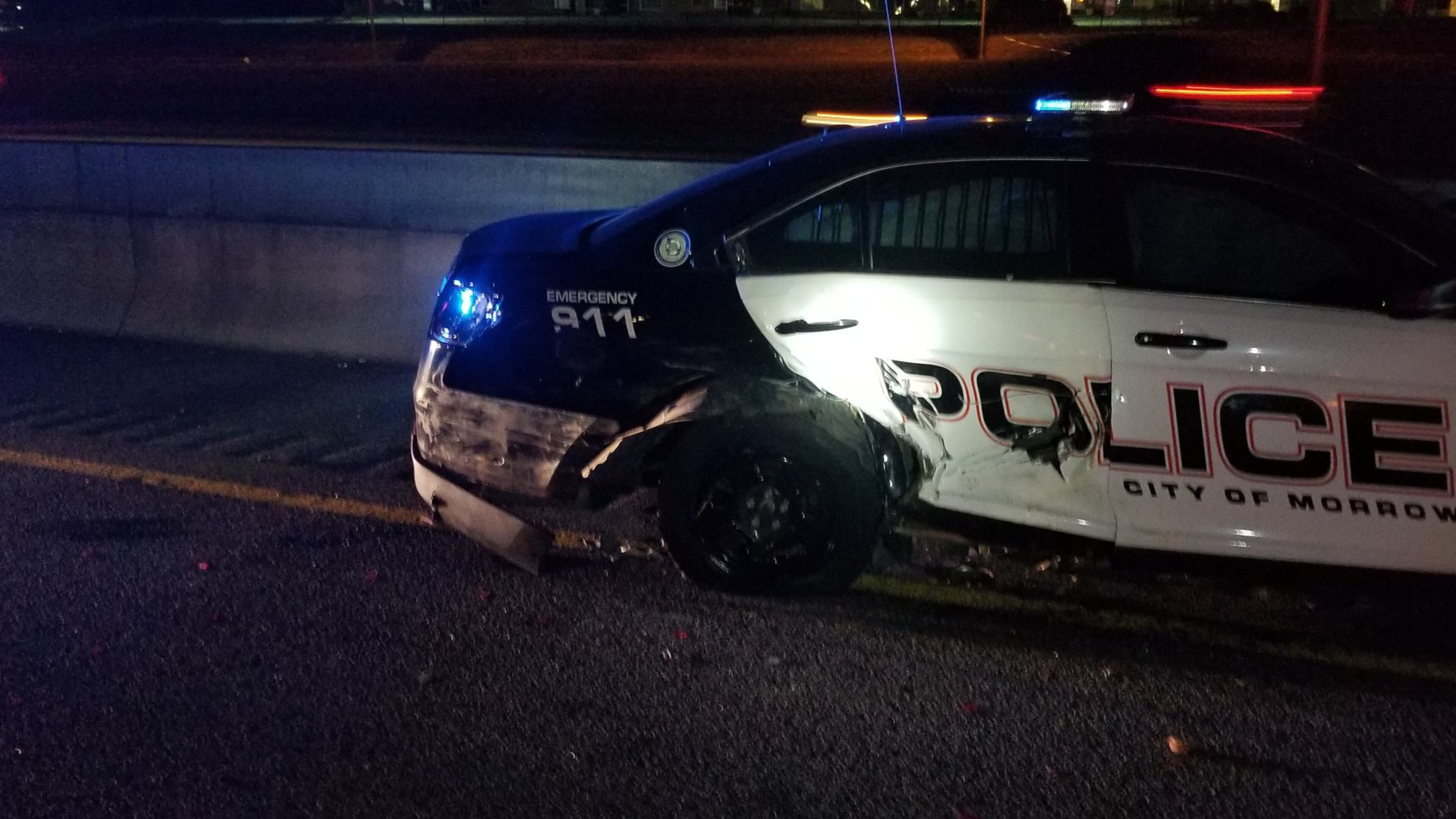 A Morrow police cruiser was hit Wednesday night while the officer was helping a stranded motorist on the side of I-75 South.