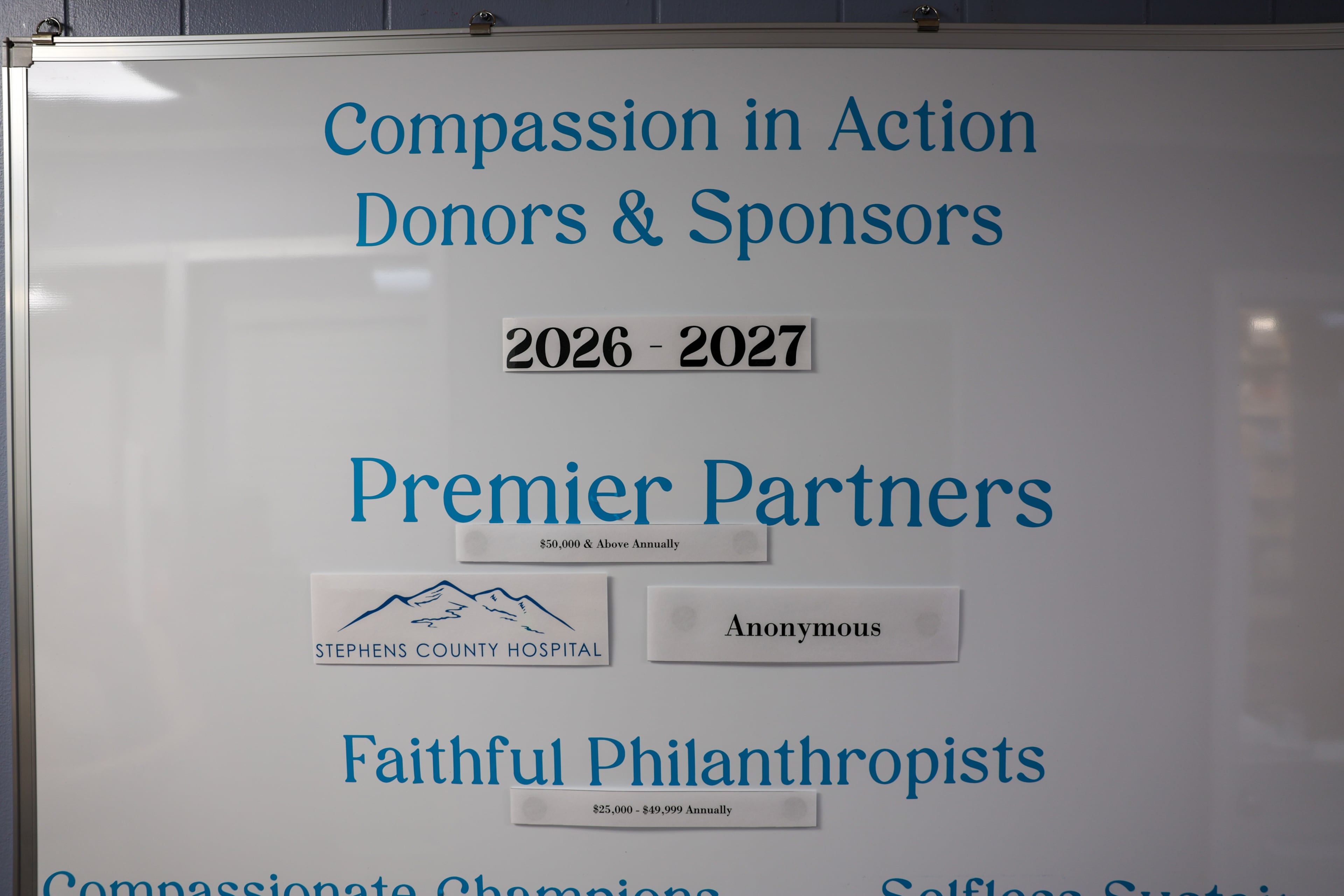 Donors appear on a fundraising board at Open Arms Clinic, a free clinic in Toccoa, on Sept. 29, 2026. The clinic provides free care to low-income residents who make less than $20,000 a year. Since COVID-era enhanced Obamacare subsidies expired late last year, the clinic's patient load has doubled. (Arvin Temkar/AJC)