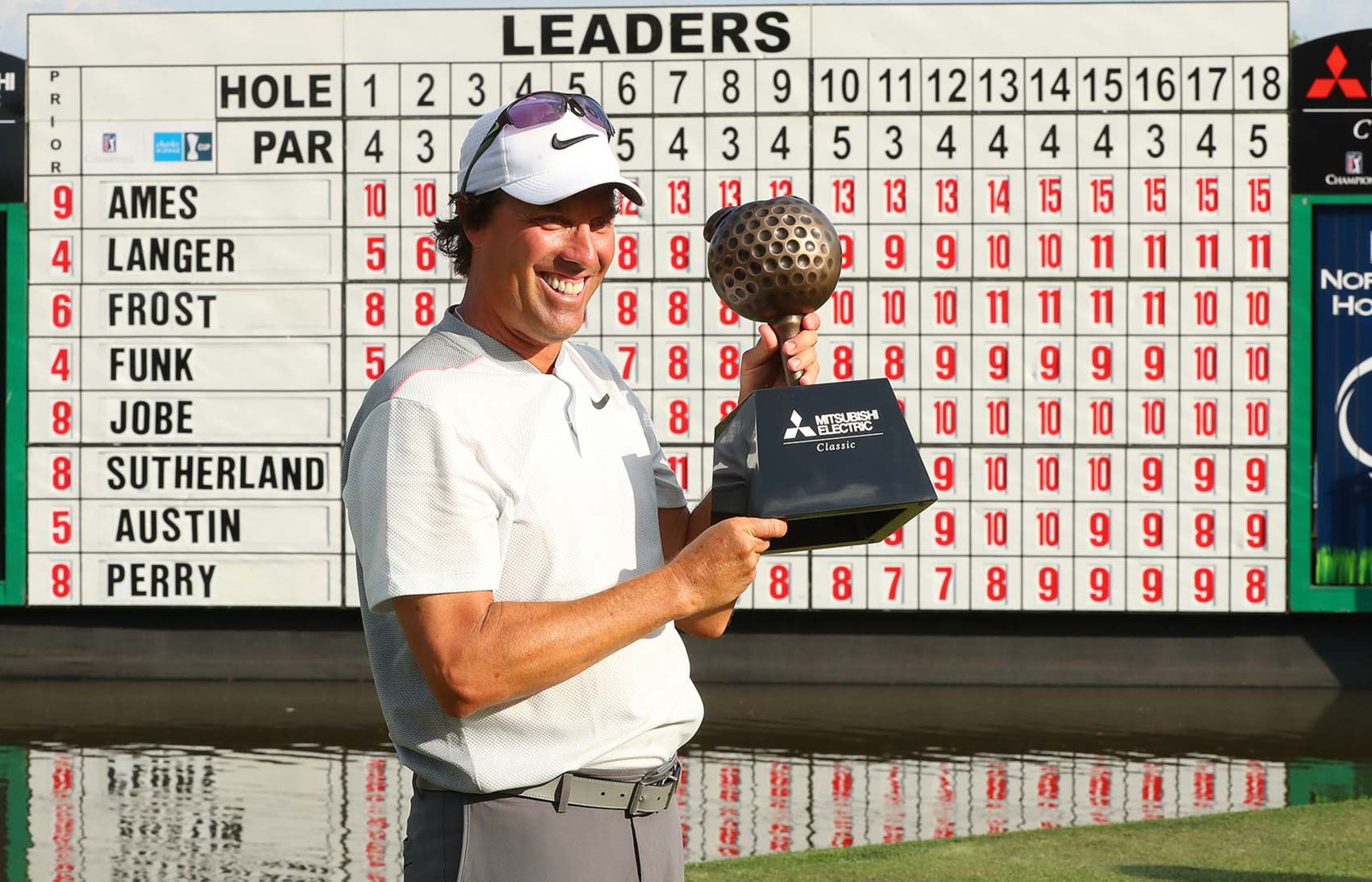 April 16, 2017, Duluth: Stephen Ames, Canada, is presented the trophy on the 18th green winning the Mitsubishi Electric Classic at TPC Sugarloaf with a 15-under par for a four stroke victory over second place finisher Bernhard Langer on Sunday, April 16, 2017, in Duluth. Curtis Compton/ccompton@ajc.com