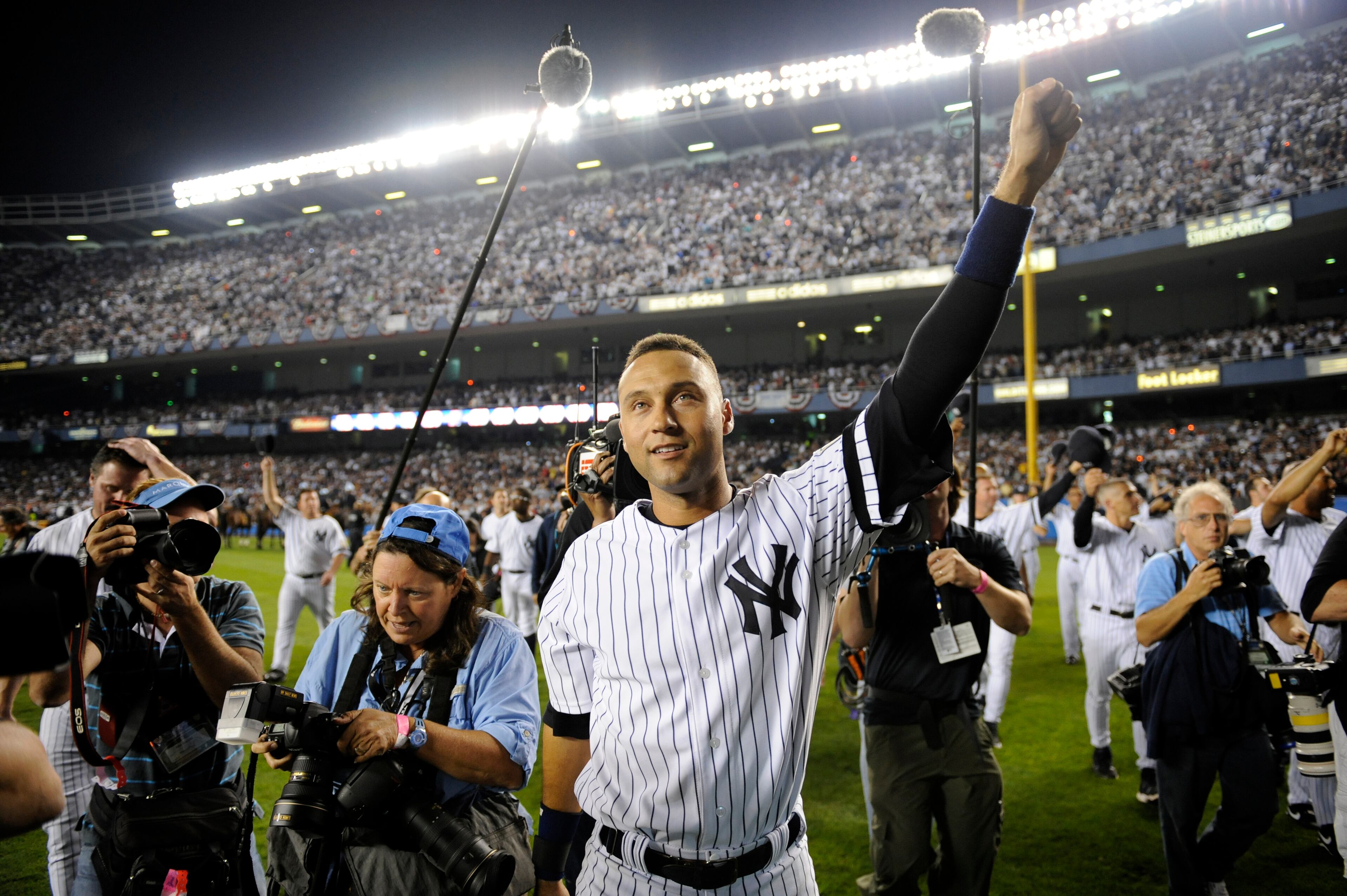 FILE - In this Sept. 21, 2008, file photo, New York Yankees' Derek Jeter acknowledges the crowd at Yankee Stadium in New York, after the Yankees played the Baltimore Orioles in the final regular season baseball game at the stadium. (AP Photo/Ed Betz, File)