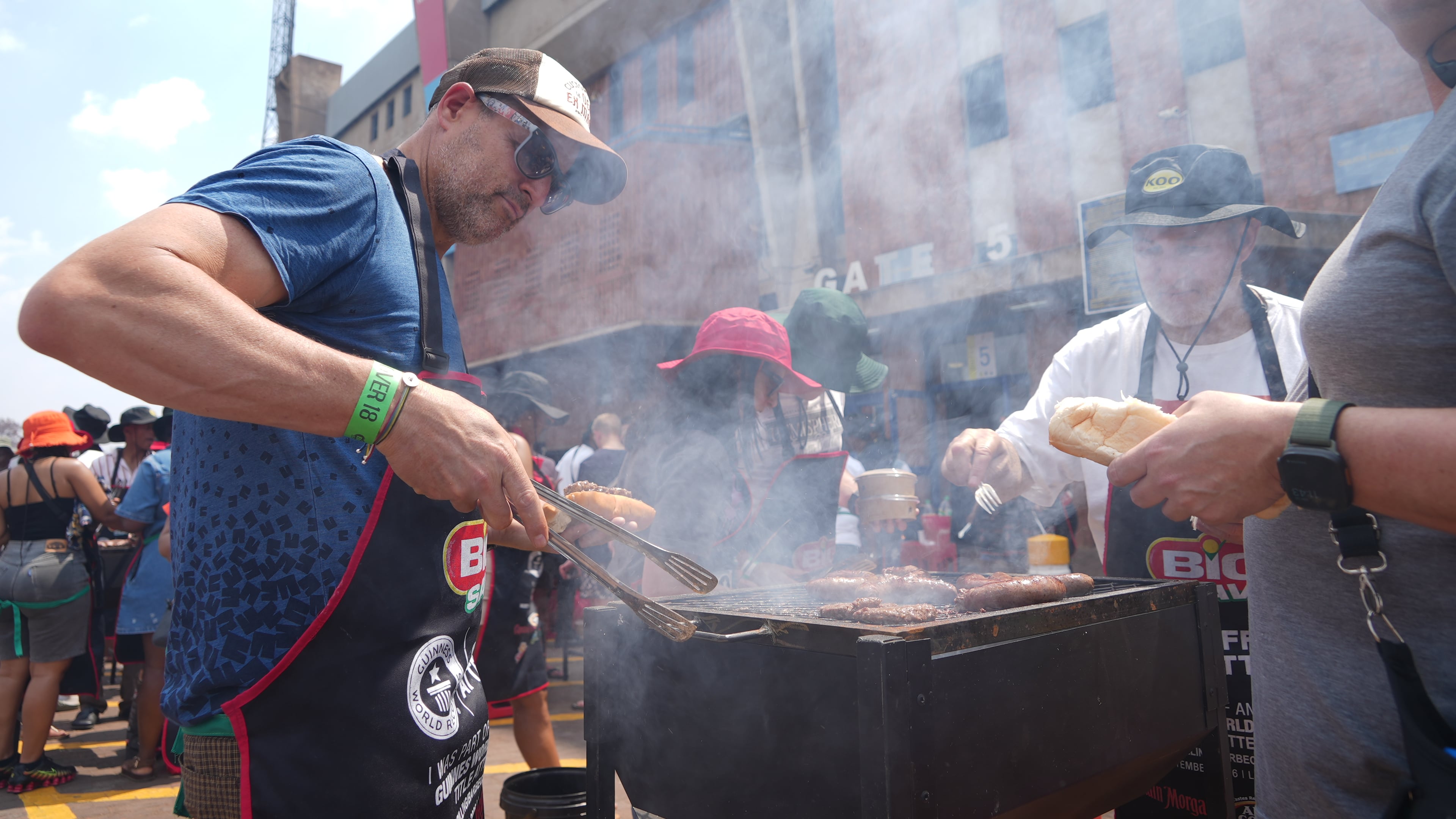 Participants grill meat during an attempt to break a world record for the most people cooking simultaneously at a barbecue at Loftus Versfeld Stadium, Pretoria, South Africa, Thursday, Sept. 24, 2026. (AP Photo/Alfonso Nqunjana)