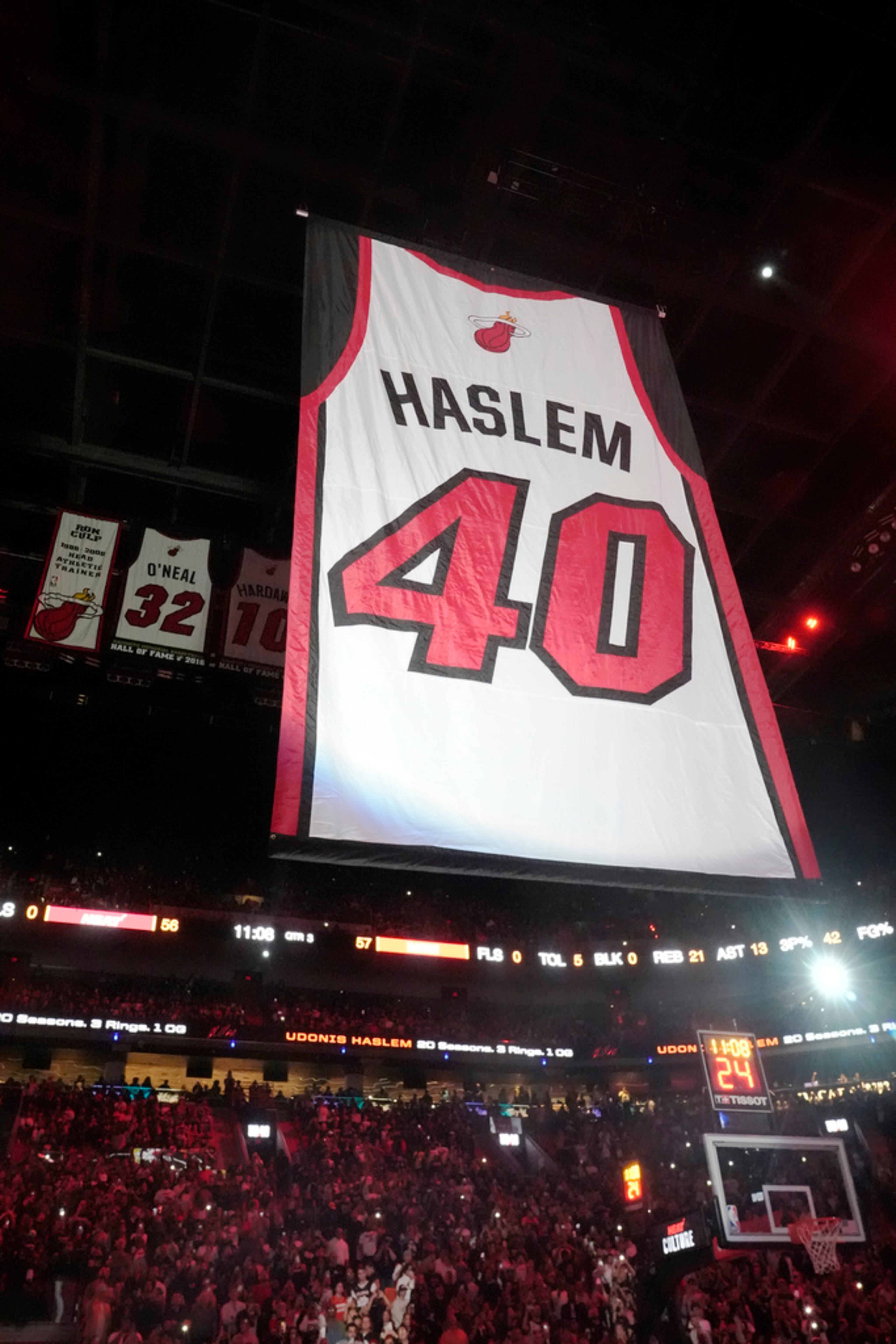Former Miami Heat player Udonis Haslem's jersey is raised at the Kaseya Arena during a half time ceremony at an NBA basketball game between the Miami Heat and the Atlanta Hawks, Friday, Jan. 19, 2024, in Miami. (AP Photo/Marta Lavandier)