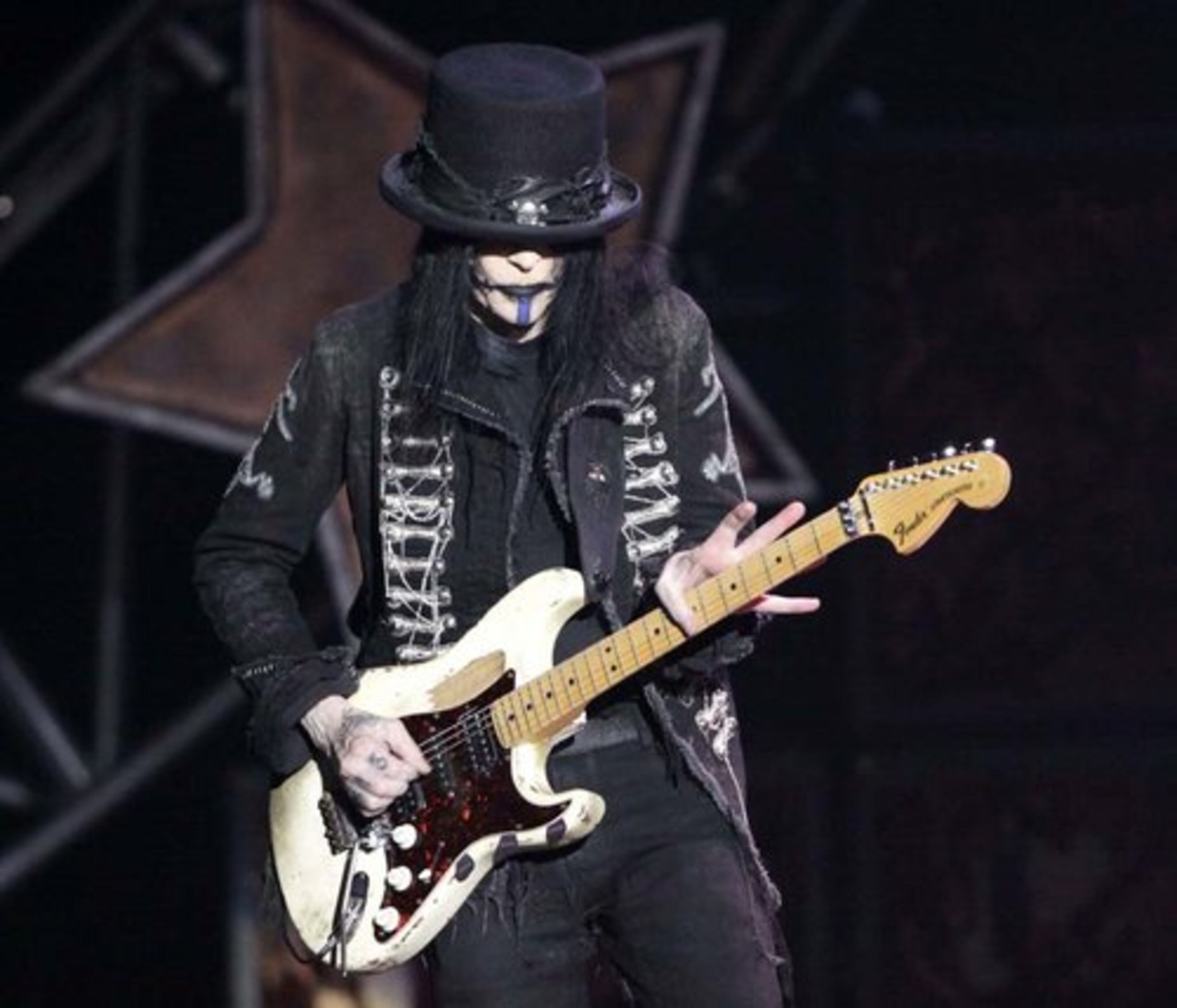 Guitarist Mick Mars and Motley Crue performing "Live Wire".