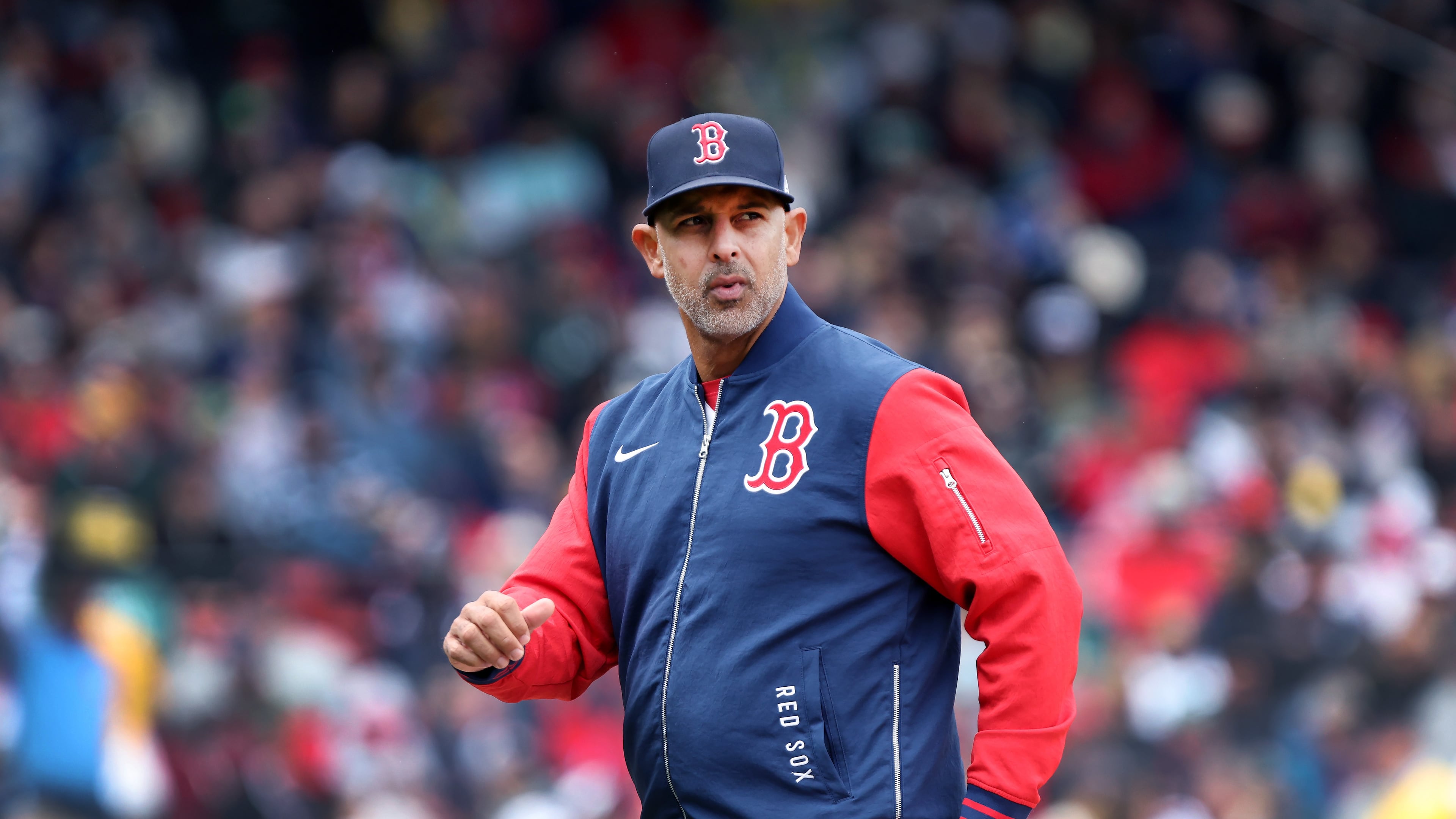 Boston Red Sox' manager Alex Cora walks back to the dugout after a mound visit during a baseball game against the Detroit Tigers, Monday, April 20, 2026, in Boston. (AP Photo/Jim Davis)