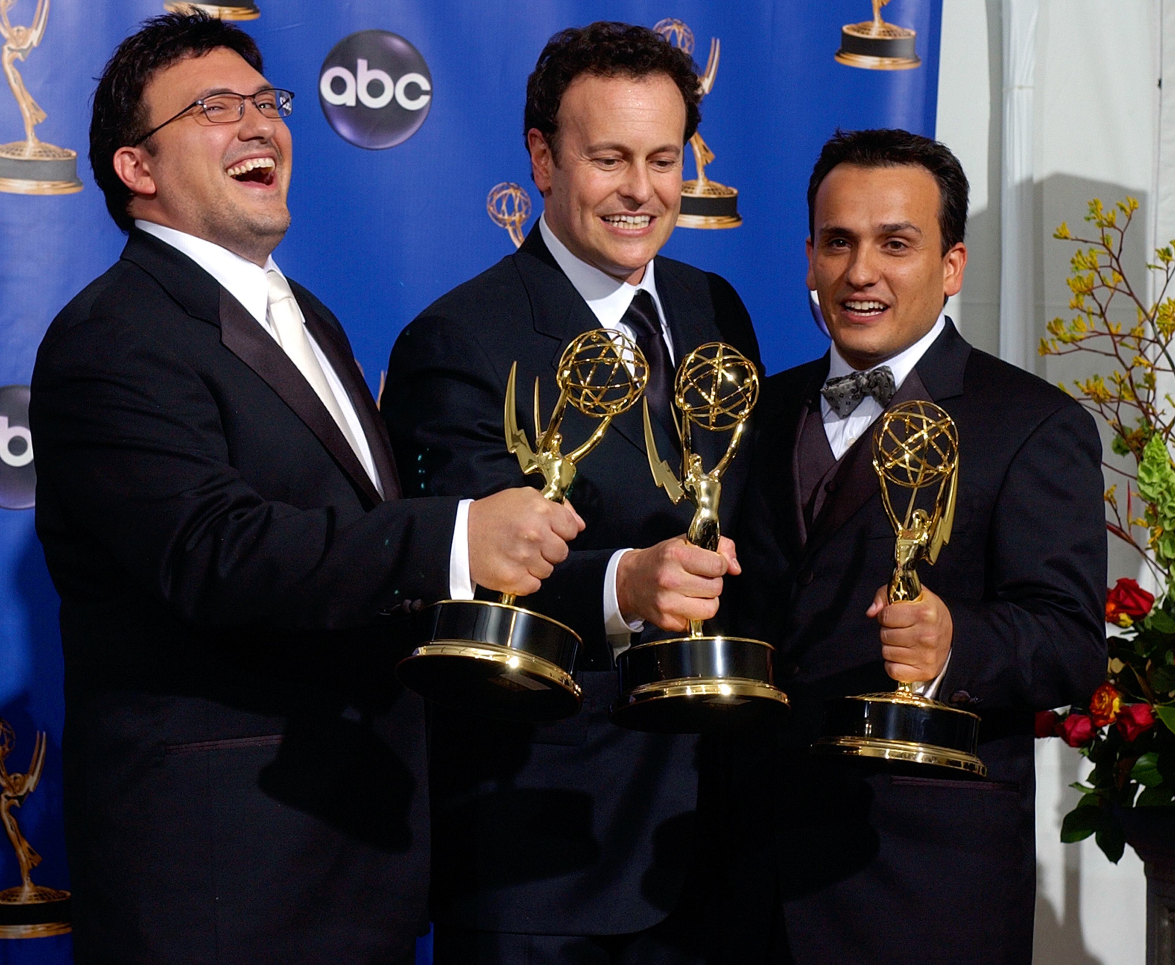 Joe Russo (L-R) Mitchell Hurwitz and Anthony Russo poses with their trophies for outstanding directing and writing for the comedy series Arrested Development at the 56th Annual Primetime Emmy Awards, Sunday, Sept. 19, at the Shrine Auditorium in Los Angeles. (AP Photo/Reed Saxon)