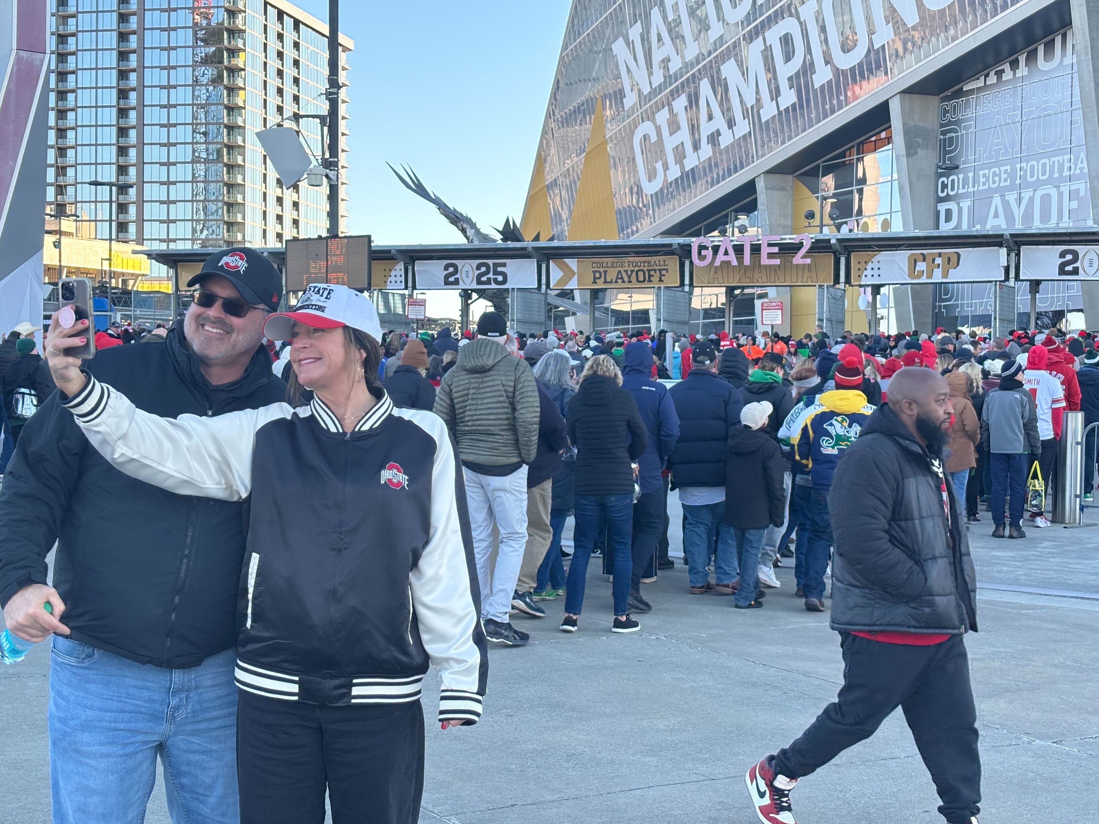 Two Ohio State fans take a selfie before their team takes on the Notre Dame Fighting Irish Monday at Mercedes-Benz Stadium in Atlanta.