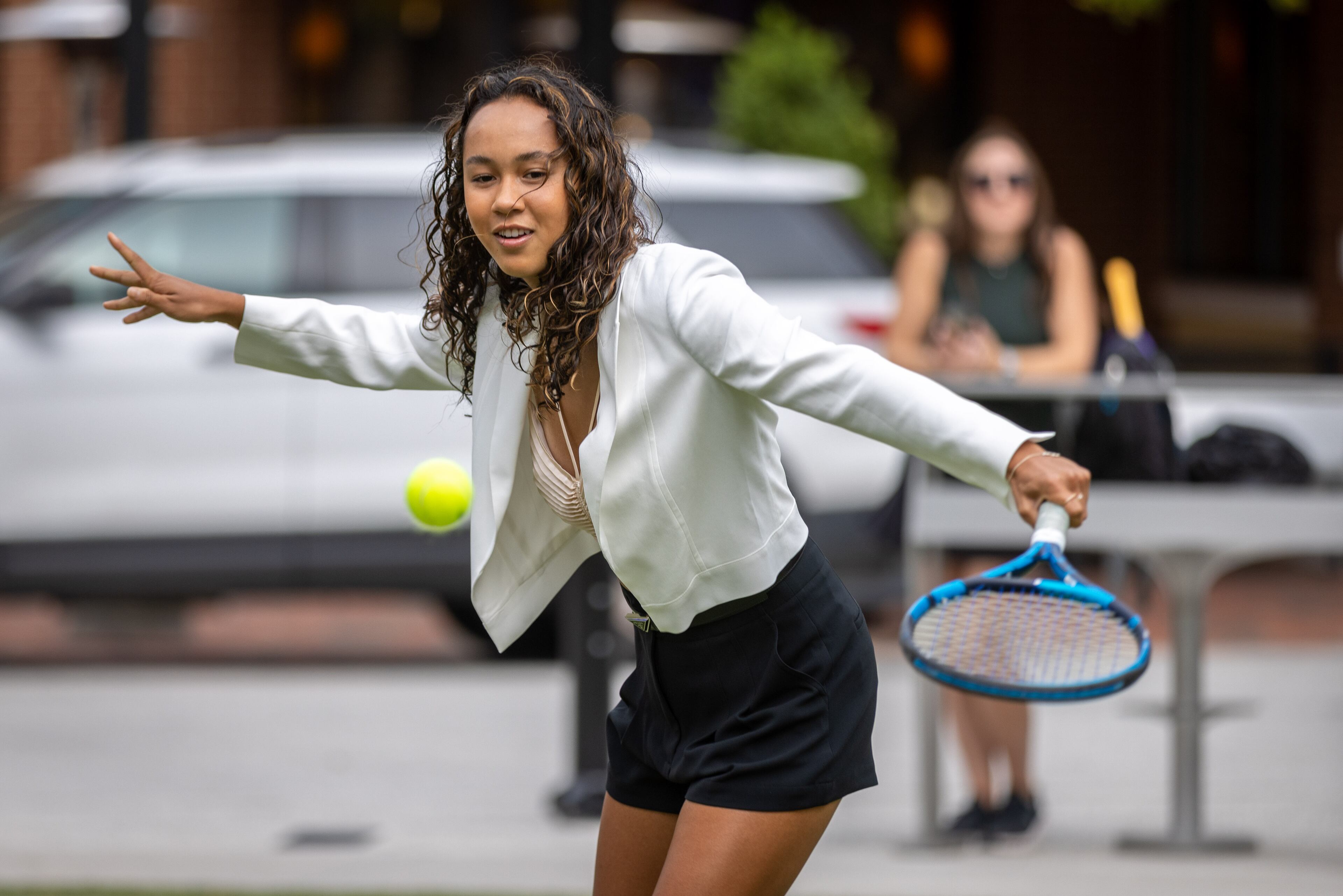 21-year-old Canadian tennis player Leylah Fernandez volleys with the official Ball Kids before the start of the Atlanta Open Media Day at Atlantic Station Tuesday, June 28, 2022. (Steve Schaefer / steve.schaefer@ajc.com)